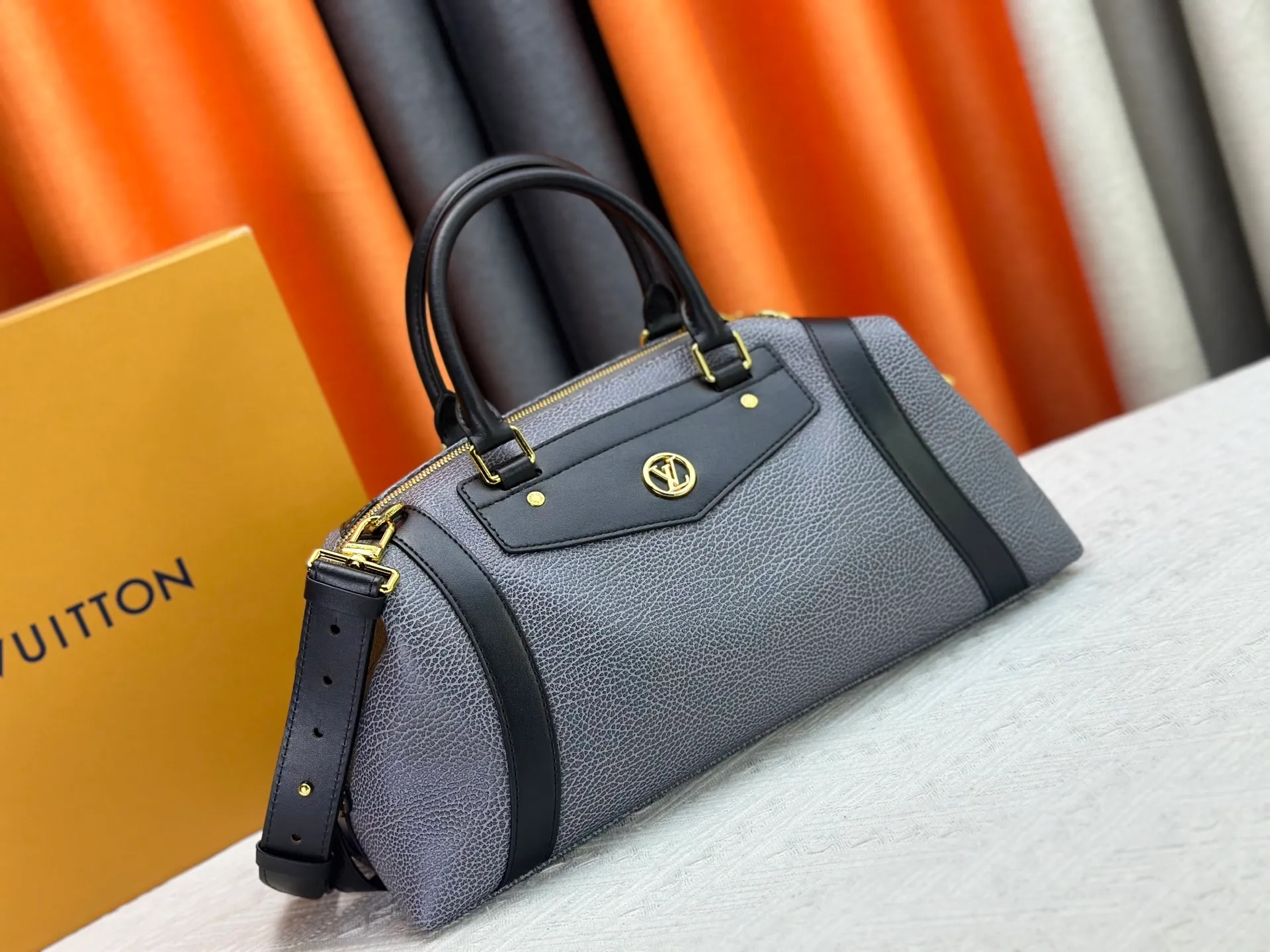 P300 small P320 medium P340 large M25557 M25561 M25561 M25566 Black M14623 mini M14514 small M14700 medium Dark gray M14702 medium Light gray M14721 small This Nano LV Rider handbag is from 2025 For the spring and summer series, pixelated grained sheep leather is blended with smooth cow leather elements, and the LV Circle logo is highlighted with elegant patches. The foldable configuration makes it easy to store in a suitcase, and the modern design adds a rock-n-roll edge to any look.  Mini 10 x 10 x 23 cm Small 12 × 12 × 30 cm Medium 15 × 15 × 38 cm (H x W x L) Sheep leather Cow leather trim Textile lining Metal hardware Zipper closure Side slip straps Internal pocket Holds a 6.7-inch smartphone, Romy card holder and lipstick Shoulder strap: removable, adjustable Strap half-length: 30.0 cm Bag strap half length adjustable to: 45.0 cm Handle: double handle