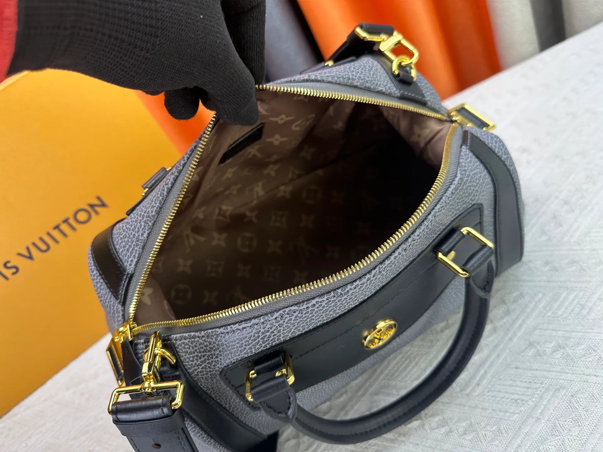 P300 small P320 medium P340 large M25557 M25561 M25561 M25566 Black M14623 mini M14514 small M14700 medium Dark gray M14702 medium Light gray M14721 small This Nano LV Rider handbag is from 2025 For the spring and summer series, pixelated grained sheep leather is blended with smooth cow leather elements, and the LV Circle logo is highlighted with elegant patches. The foldable configuration makes it easy to store in a suitcase, and the modern design adds a rock-n-roll edge to any look.  Mini 10 x 10 x 23 cm Small 12 × 12 × 30 cm Medium 15 × 15 × 38 cm (H x W x L) Sheep leather Cow leather trim Textile lining Metal hardware Zipper closure Side slip straps Internal pocket Holds a 6.7-inch smartphone, Romy card holder and lipstick Shoulder strap: removable, adjustable Strap half-length: 30.0 cm Bag strap half length adjustable to: 45.0 cm Handle: double handle