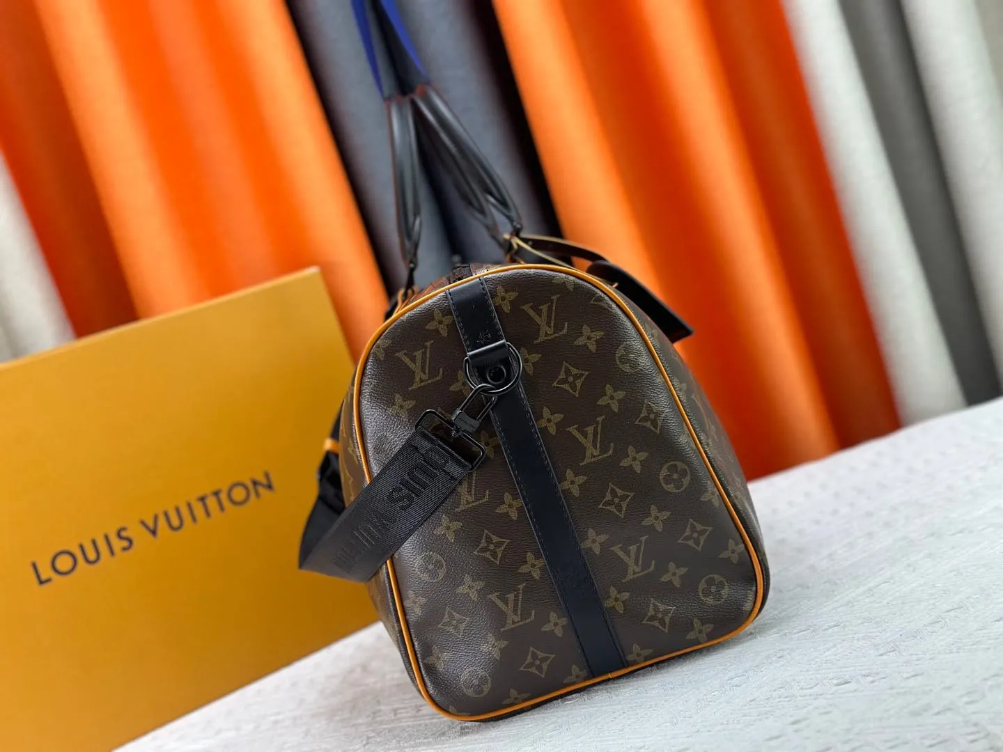 P360 M46703 M41416 This Keepall Bandoulière 45 travel bag introduces classic heritage in Monogram Macassar coated canvas. Side straps are cut out of contrasting leather, leather handles and hardware at the top add a calming touch, and the detachable and adjustable fabric shoulder strap is woven with the Louis Vuitton logo. Dimensions: 45 x 27 x 20 cm (Length x Height x Width) - Monogram Macassar coated canvas - Cow leather trim - Textile lining - Metal hardware - Carry-on baggage dimensions - Double zip closure - Padlock - Internal zip pocket - Removable name tag - Shoulder strap: removable, adjustable - Handles: Double handles - This product is made in one of France, Spain, Italy and the United States