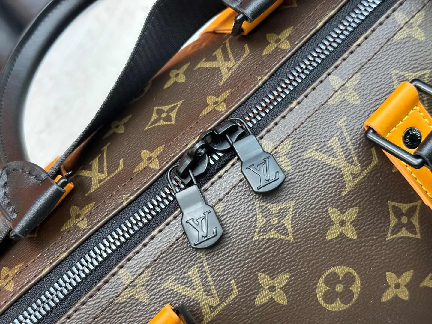 P360 M46703 M41416 This Keepall Bandoulière 45 travel bag introduces classic heritage in Monogram Macassar coated canvas. Side straps are cut out of contrasting leather, leather handles and hardware at the top add a calming touch, and the detachable and adjustable fabric shoulder strap is woven with the Louis Vuitton logo. Dimensions: 45 x 27 x 20 cm (Length x Height x Width) - Monogram Macassar coated canvas - Cow leather trim - Textile lining - Metal hardware - Carry-on baggage dimensions - Double zip closure - Padlock - Internal zip pocket - Removable name tag - Shoulder strap: removable, adjustable - Handles: Double handles - This product is made in one of France, Spain, Italy and the United States