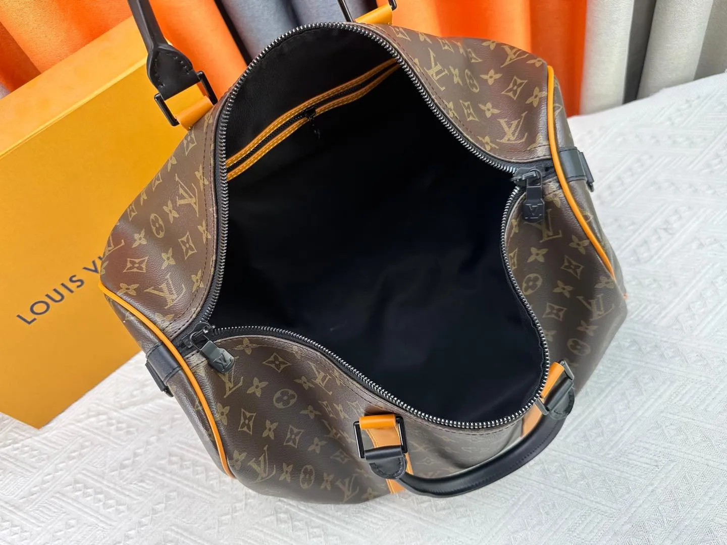 P360 M46703 M41416 This Keepall Bandoulière 45 travel bag introduces classic heritage in Monogram Macassar coated canvas. Side straps are cut out of contrasting leather, leather handles and hardware at the top add a calming touch, and the detachable and adjustable fabric shoulder strap is woven with the Louis Vuitton logo. Dimensions: 45 x 27 x 20 cm (Length x Height x Width) - Monogram Macassar coated canvas - Cow leather trim - Textile lining - Metal hardware - Carry-on baggage dimensions - Double zip closure - Padlock - Internal zip pocket - Removable name tag - Shoulder strap: removable, adjustable - Handles: Double handles - This product is made in one of France, Spain, Italy and the United States