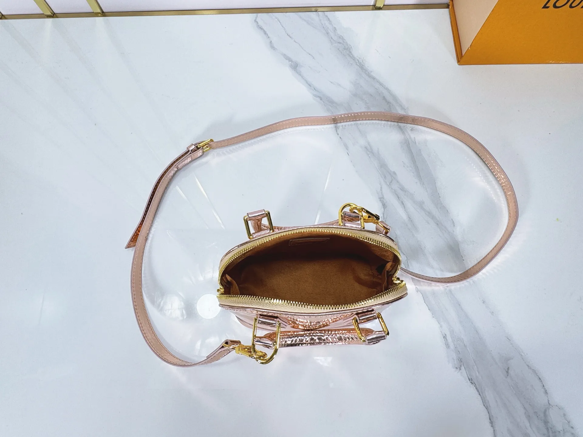 P220 upgraded original M26335 M82717 This Nano Alma handbag highlights the style of the LV Ski series with this season’s technological details. The Monogram Miroir weather-resistant canvas surface is dip-dyed in Silver tones and paired with matching hardware for a dazzling look. Inject retro-futuristic style into any outfit. An LV logo padlock and removable shoulder strap complete the look. Dimensions: 18 x 12 x 8 (cm) ((length x height x width)