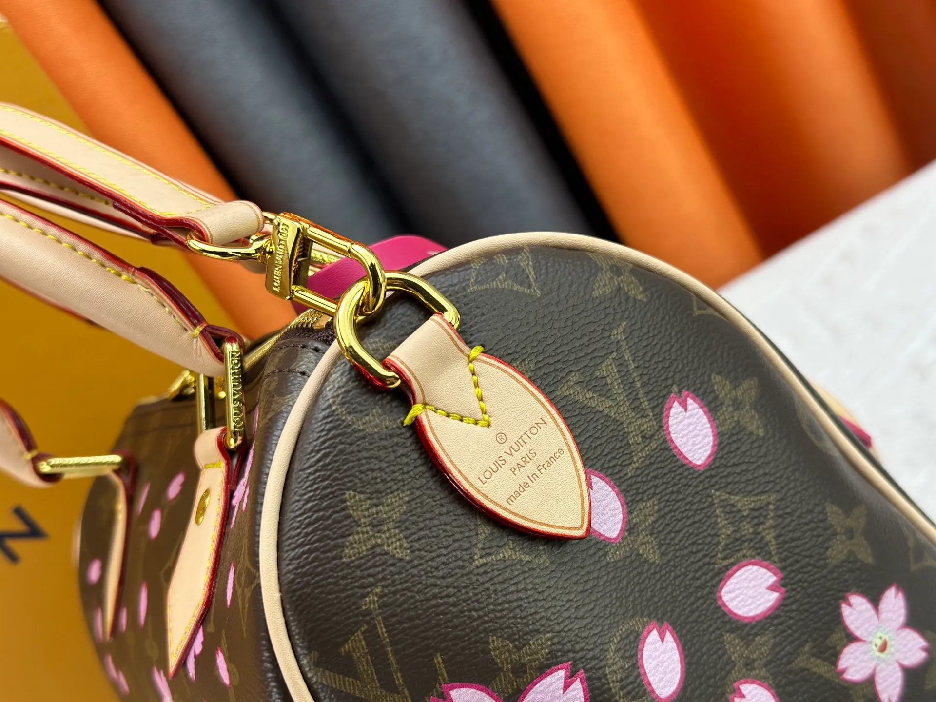 P260 M14174 This Speedy Bandoulière 25 handbag is from the Louis Vuitton x Takashi Murakami replica series. It incorporates the brand's classic Monogram coating into Takashi Murakami's vivid Cherry Blossom pattern, and then continues the same element into the removable bag decoration. Cow leather constructed Toron handles and removable leather shoulder strap, dual zippers and padlock keep personal belongings safe and secure.  19 x 15 x 25 cm (H x W x L) Cherry Blossom Monogram coated canvas Cow leather trim Removable Cherry Blossom trim Textile lining Metal hardware Double zip closure Internal zip pocket Padlock Holds a 6.7" smartphone, Victorine short wallet, headphones and keys Shoulder strap: removable, not adjustable Half-length strap: 44.0 cm Handles: Double handles