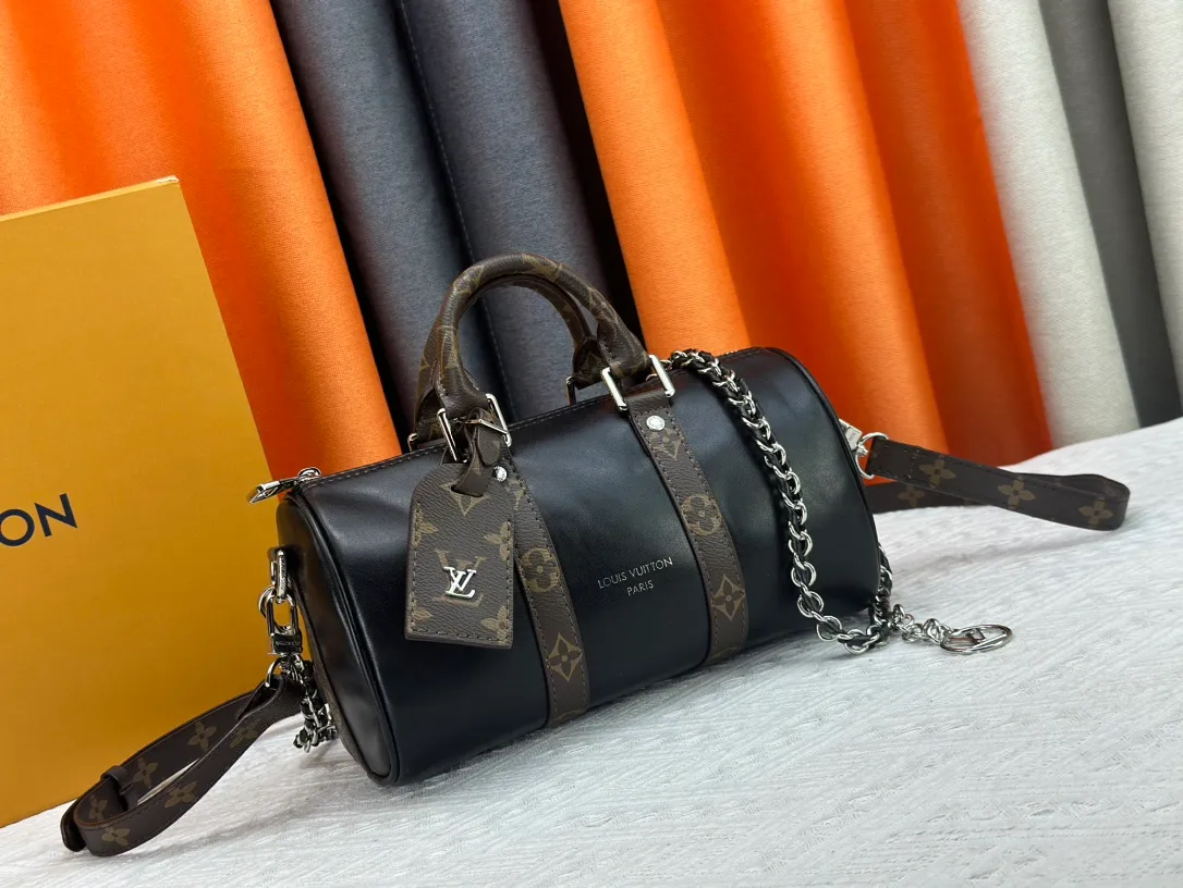 P260 Upgraded original version N00105 checkerboard green M20900.M46271 black flower, full leather black, M31044 orange, M11542 presbyopia, M24849 presbyopic flower. This Keepall 25 handbag is made of Monogram Eclipse Reverse denim denim canvas, showing an elegant reinterpretation of Louis Vuitton's classic pattern. Reinforced straps and leather name tags are signature elements of the Keepall collection, while a zipper closure keeps personal items safe and secure. Dimensions: 25.0 x 15.0 x 11.0 cm (length x height x width)