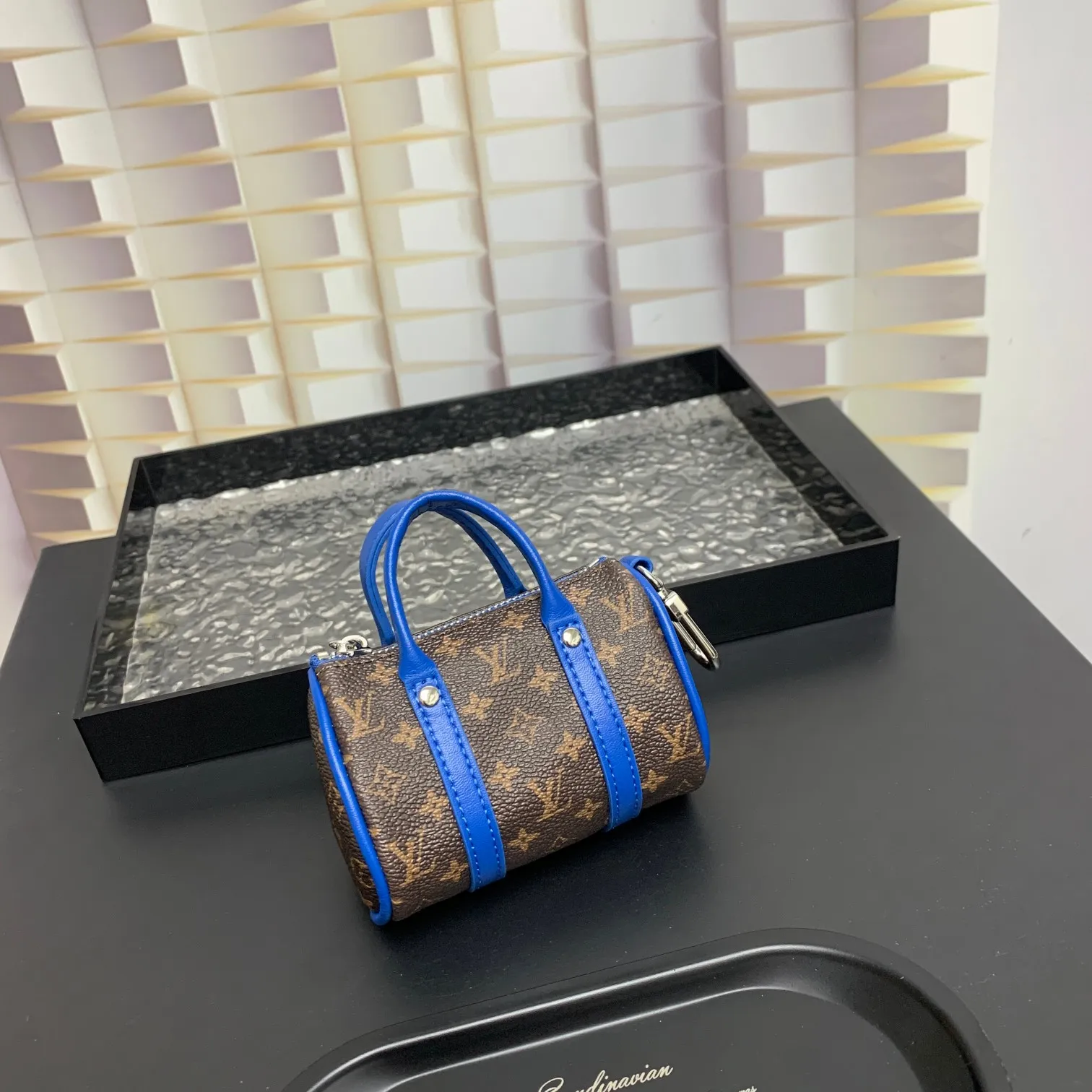💰200 shipped😍 MINI KEEPALL bag charm and keychain ☀️Louis Vuitton Louis Vuitton lv mini pillow bag pendant ☀️This Mini Keepall bag charm and keychain condenses the classic handbag configuration, boldly showing the spirit of adventure. Monogram canvas with LV inscribed hook buckle, whether hung on a belt or handbag, its zipper closure and built-in keychain ensure secure storage