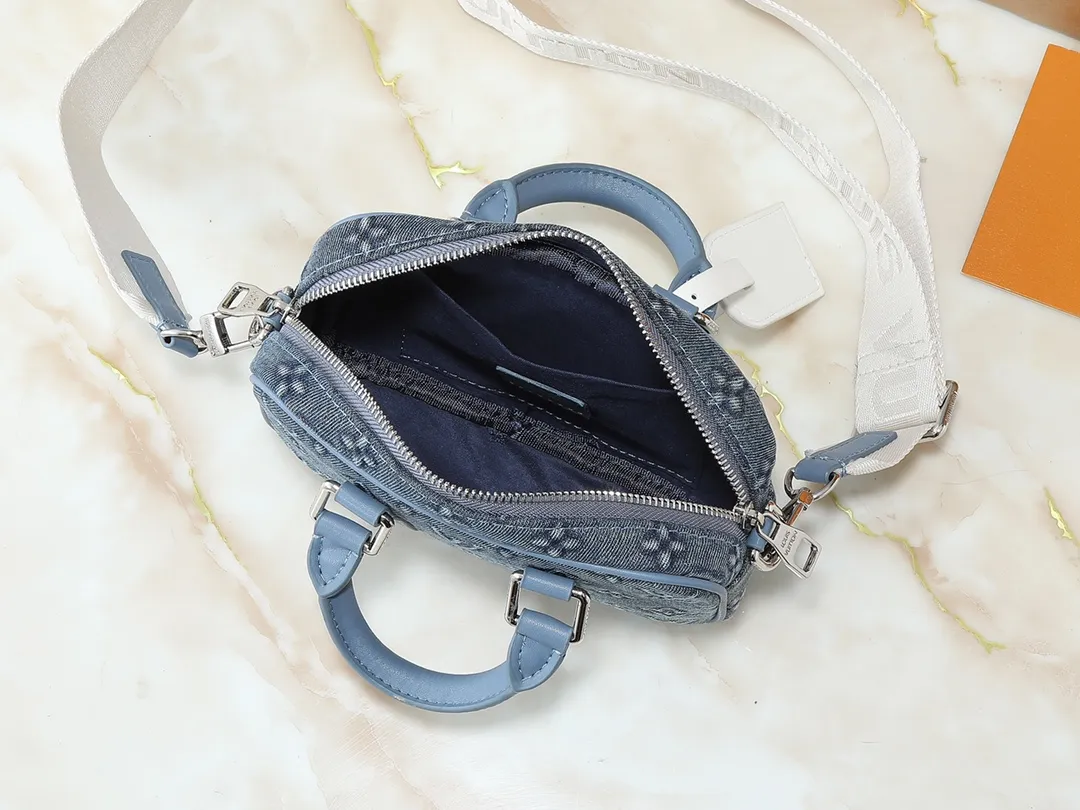 💰240💰Upgraded original M82770 black flower denim blue This Nano Porte Documents Voyage handbag pays tribute to the classic prototype design, inheriting elements such as zipper opening and closing, handles and detachable and adjustable shoulder straps, and can easily control business occasions with a personalized and trendy attitude. The spacious main compartment holds a cell phone and wallet, making it ideal for shoulder or cross-body wear. Dimensions: 20 x 13 x 5.5 (Length x Height x Width)