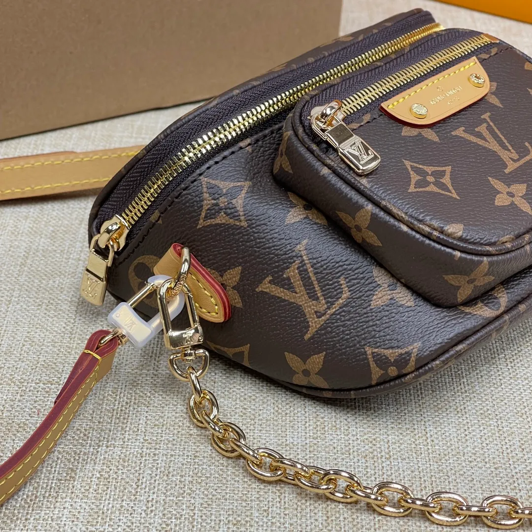 [Upgraded version] P480🐶Upgraded version M82208🐶MINI with full package BUMBAG handbag This Mini Bumbag handbag comes from the LV Gradient series and is made of Monogram Empreinte leather with Monogram embossing to render gradient midsummer colors. The on-trend construction features a zipped main compartment and a front pocket with a Louis Vuitton leather label. With the detachable chain and detachable and adjustable shoulder strap, it can be worn as a shoulder or cross-body bag. Dimensions: 17 x 12 x 9.5 cm