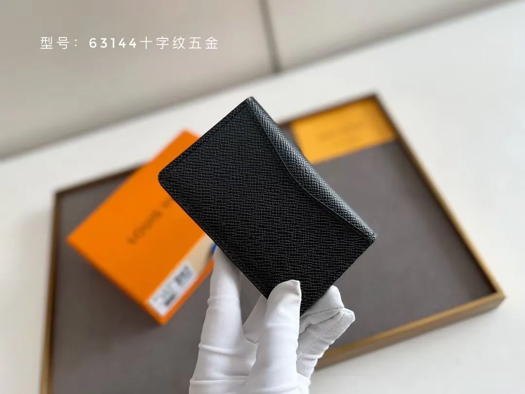 P100 💎Original # Cross Pattern Hardware Small Card Holder Louis vuitton This pocket leather wallet has seven compartments, which can hold credit cards, bus cards, business cards, and even city maps. Damier canvas, leather edge - two credit card compartments - four inner compartments - one outer compartment. Model M63144 Cross Pattern Hardware Size: 7X11.
