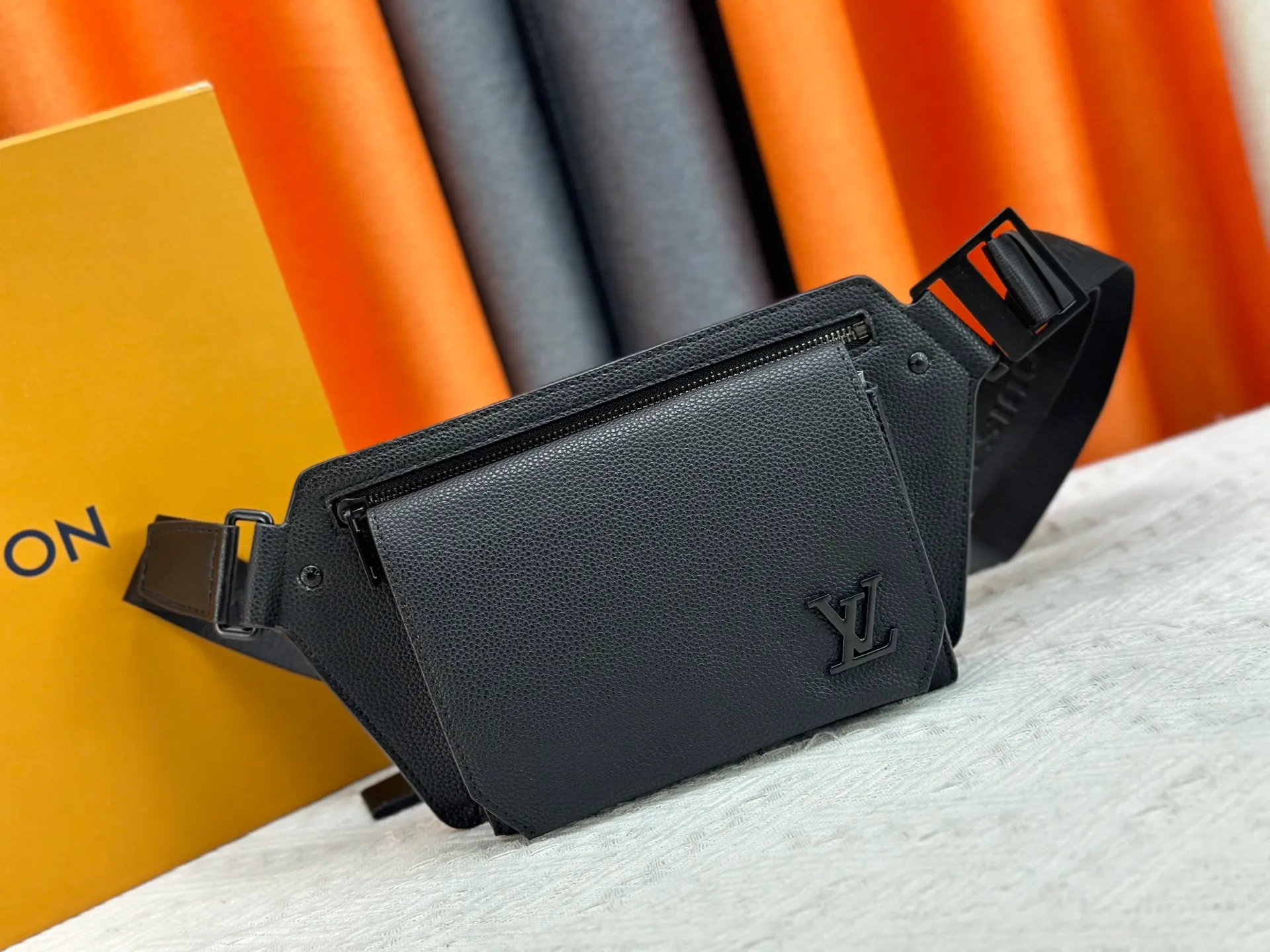 P240 M57081 The new LV Aerogram chest bag series is a minimalist and elegant style that innovates the trend. Fine calfskin, as soft as old aviation letterhead, is embellished with a matte metal LV logo. The main compartment and flap front pocket provide plenty of space for weekend trips or wandering around the city. 30x 16x 3cm (Length x Height x Width) Grained calfskin Leather trim Textile lining Metal hardware Metal lettering Customizable label Fabric shoulder strap Zip closure Flap front pocket with magnetic closure This product is made in France, Spain, Italy and the United States.