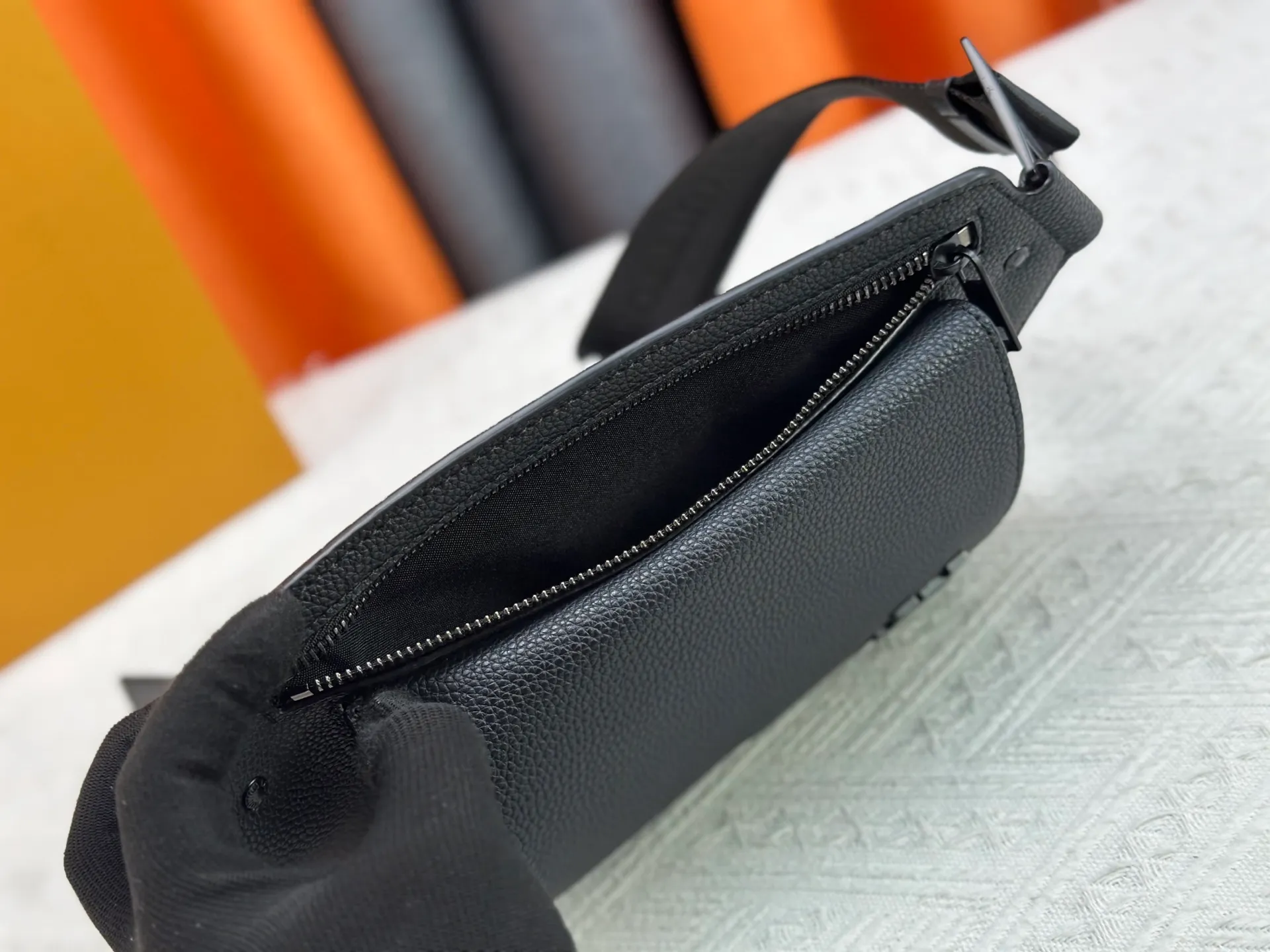 P240 M57081 The new LV Aerogram chest bag series is a minimalist and elegant style that innovates the trend. Fine calfskin, as soft as old aviation letterhead, is embellished with a matte metal LV logo. The main compartment and flap front pocket provide plenty of space for weekend trips or wandering around the city. 30x 16x 3cm (Length x Height x Width) Grained calfskin Leather trim Textile lining Metal hardware Metal lettering Customizable label Fabric shoulder strap Zip closure Flap front pocket with magnetic closure This product is made in France, Spain, Italy and the United States.