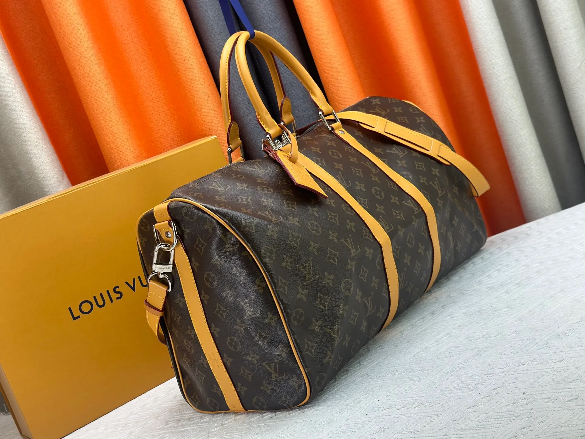 P360 Upgraded Original M41416 M12634 Yellow M12633 Dark Blue M12629 Light Blue M12630 Dark Green Top Original This Keepall Bandoulière 50 travel bag is made of Monogram Macassar canvas, which simultaneously renders bright colors for the side straps, nameplate, fabric lining and top leather handle. The size of your carry-on luggage hides plenty of space. 50.0 x 29.0 x 23.0 cm (L x H x W) • Monogram Macassar coated canvas • Cow leather trim • Textile lining • Metal hardware • Carry-on dimensions • Double zipper closure • Padlock • Removable name tag • Internal zip pocket • Shoulder strap: removable, adjustable • Half-length strap: 36.0 cm • Half-length strap adjustable to: 50.0 cm • Handle: Double handle