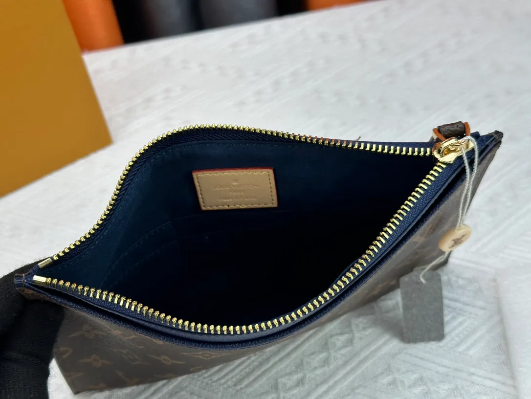 P 120 M60910, actual photo This handbag is exquisitely crafted. The Pallas handbag combines classic Monogram canvas with bright colors to create a pleasing effect. It holds an iPad mini for the ultimate feminine look and fits easily into most Louis Vuitton shoulder bags and tote styles. Carry loop with bright gold-tone brass hardware, calfskin lining, 6 credit card slots and a contrasting external patch pocket. Dimensions: 24x17,