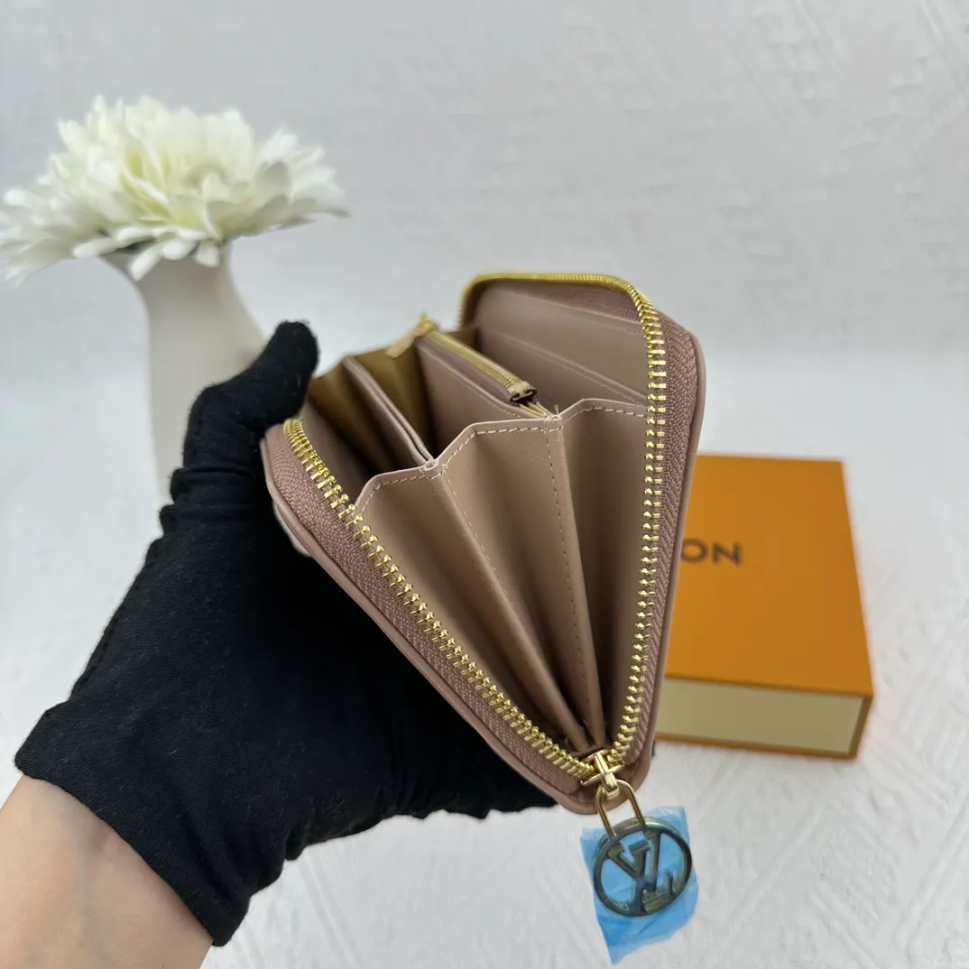 P130 M81511 Apricot Sewn with padded Monogram embossed lambskin, it complements the Coussin leather boutique series. Beautifully designed with a gold-tone zipper embossed with the LV Circle signature pull, the interior of the all-in-one wallet is packed with practical features, including three large compartments, a coin compartment and 12 business card slots. Dimensions: 19.5 x 10.5 x 2.5 cm