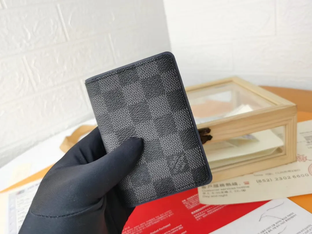 P110💰Top Original💎N63144 black check with yellow, this pocket wallet combines the elegance of Damier Graphite canvas with the delicate texture of Epi leather, with stripes emblazoned with the Louis Vuitton logo. The elegant design can accommodate credit cards, banknotes and receipts, making it suitable for daily carrying or gift giving. Detailed Features 8.0 x 11.0 x 1.0 cm (L x H x W) Epi leather and Damier Graphite coated canvas Coated cowhide leather trim Cowhide lining, card compartment, inner pocket, outer patch pocket This product is made in one of France, Spain, Italy and the United States