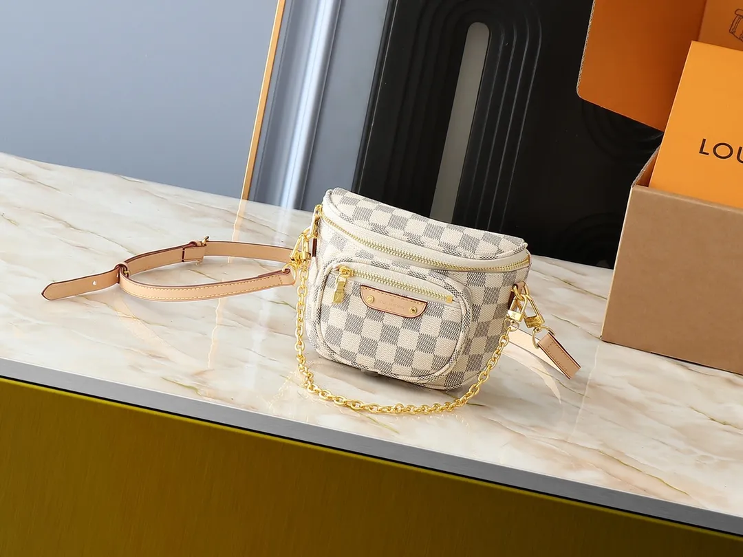 💰220💰Upgraded from the original M46917 M82335 M83275 M82208 M82347 This Mini Bumbag handbag comes from the LV Gradient series and uses the Monogram embossing of Monogram Empreinte leather to render gradient midsummer colors. The on-trend construction features a zipped main compartment and a front pocket with a Louis Vuitton leather label. With the detachable chain and detachable and adjustable shoulder strap, it can be worn as a shoulder or cross-body bag. 17.0 x 12.0 x 9.5 cm (L x H x W) • Monogram Empreinte embossed soft-grained cowhide leather • Textile lining • Metal hardware • Zip closure • Zip front pocket • Shoulder strap: removable, adjustable • Half-length strap: 32.0 cm • Half-length strap adjustable to: 44.0 cm • Chain: Removable • Half-length chain: 20.0 cm