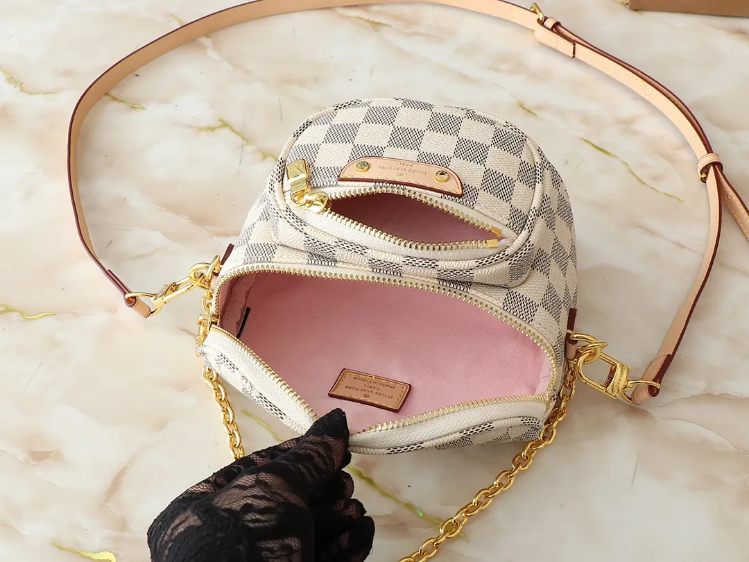 💰220💰Upgraded from the original M46917 M82335 M83275 M82208 M82347 This Mini Bumbag handbag comes from the LV Gradient series and uses the Monogram embossing of Monogram Empreinte leather to render gradient midsummer colors. The on-trend construction features a zipped main compartment and a front pocket with a Louis Vuitton leather label. With the detachable chain and detachable and adjustable shoulder strap, it can be worn as a shoulder or cross-body bag. 17.0 x 12.0 x 9.5 cm (L x H x W) • Monogram Empreinte embossed soft-grained cowhide leather • Textile lining • Metal hardware • Zip closure • Zip front pocket • Shoulder strap: removable, adjustable • Half-length strap: 32.0 cm • Half-length strap adjustable to: 44.0 cm • Chain: Removable • Half-length chain: 20.0 cm