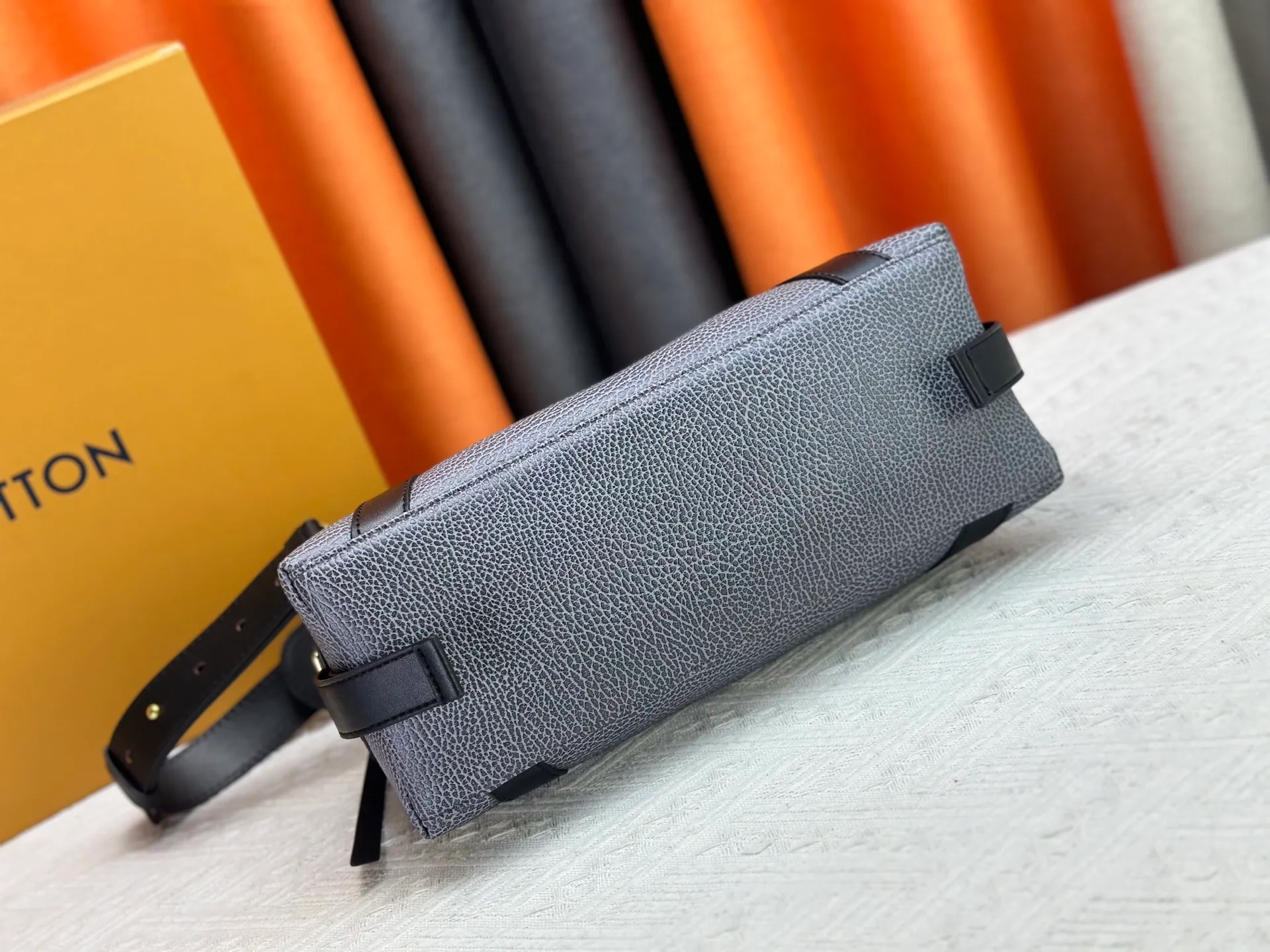 P300 small P320 medium P340 large M25557 M25561 M25561 M25566 Black M14623 mini M14514 small M14700 medium Dark gray M14702 medium Light gray M14721 small This Nano LV Rider handbag is from 2025 For the spring and summer series, pixelated grained sheep leather is blended with smooth cow leather elements, and the LV Circle logo is highlighted with elegant patches. The foldable configuration makes it easy to store in a suitcase, and the modern design adds a rock-n-roll edge to any look.  Mini 10 x 10 x 23 cm Small 12 × 12 × 30 cm Medium 15 × 15 × 38 cm (H x W x L) Sheep leather Cow leather trim Textile lining Metal hardware Zipper closure Side slip straps Internal pocket Holds a 6.7-inch smartphone, Romy card holder and lipstick Shoulder strap: removable, adjustable Strap half-length: 30.0 cm Bag strap half length adjustable to: 45.0 cm Handle: double handle