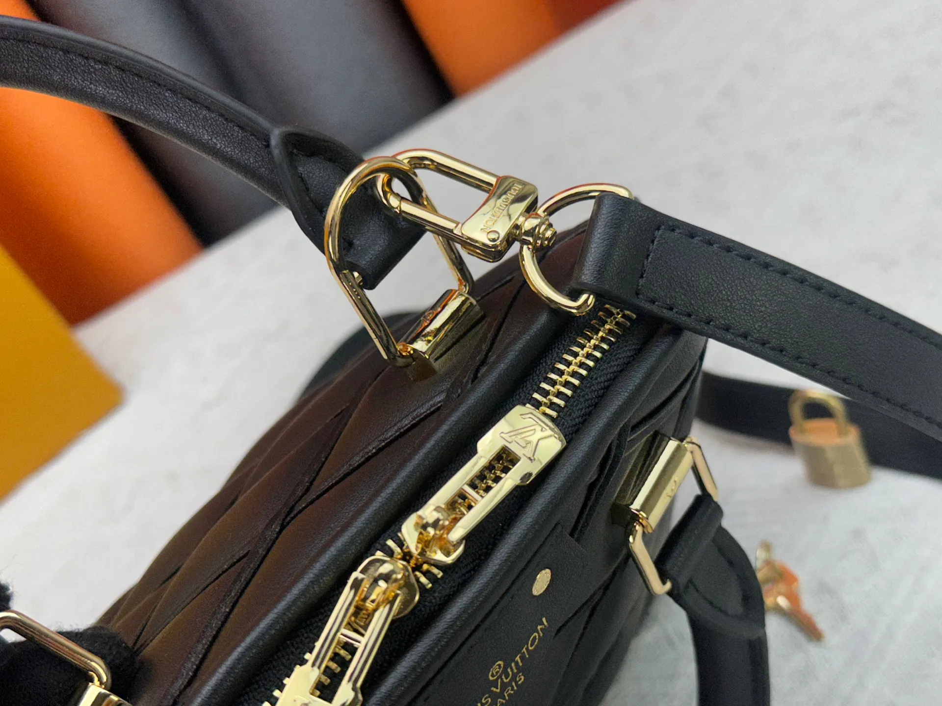 P360 M83048 M53152 This Nano Alma handbag is a pocket-sized version of Louis Vuitton's classic Alma handbag. It is made of soft lambskin with a Malletage quilting pattern, recalling the diamond inner panel of the brand's traditional hard luggage. The elegant handle, dazzling chain and detachable and adjustable leather shoulder strap enable a variety of carrying styles. Dimensions: 23.5x17.5x11.5cm