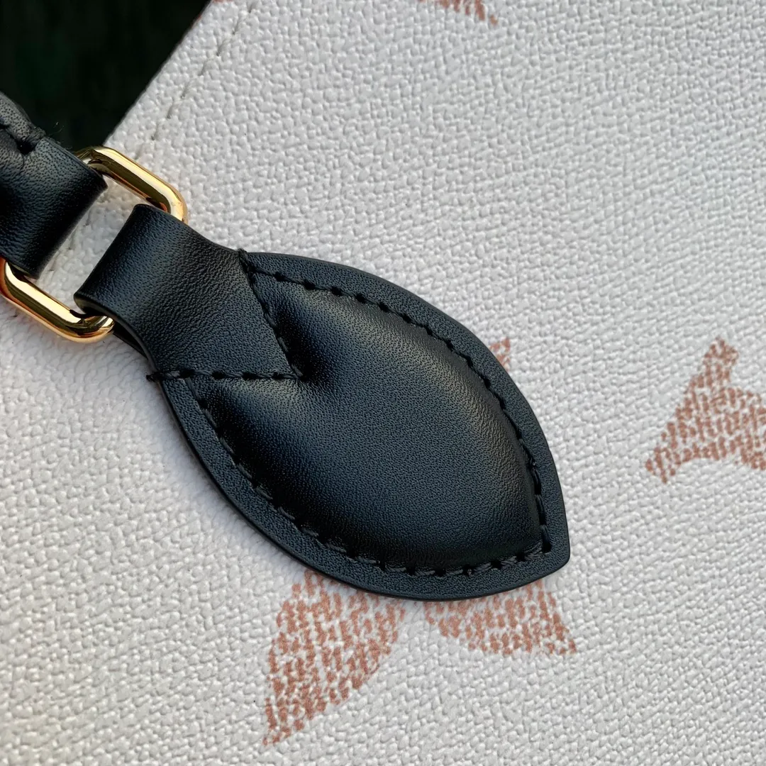 💰960 Top Original Order ✨M46912 This OnTheGo medium handbag is painted on coated canvas with a large Monogram pattern, and the trim and lining are covered with intricate Monogram Ypp flowers, showing the inspiration of traditional Portuguese tiles. The ample space combined with the long and short handle design makes it a perfect choice for daily travel. Detailed features 35 x 27 x 14 cm (length x height x width)