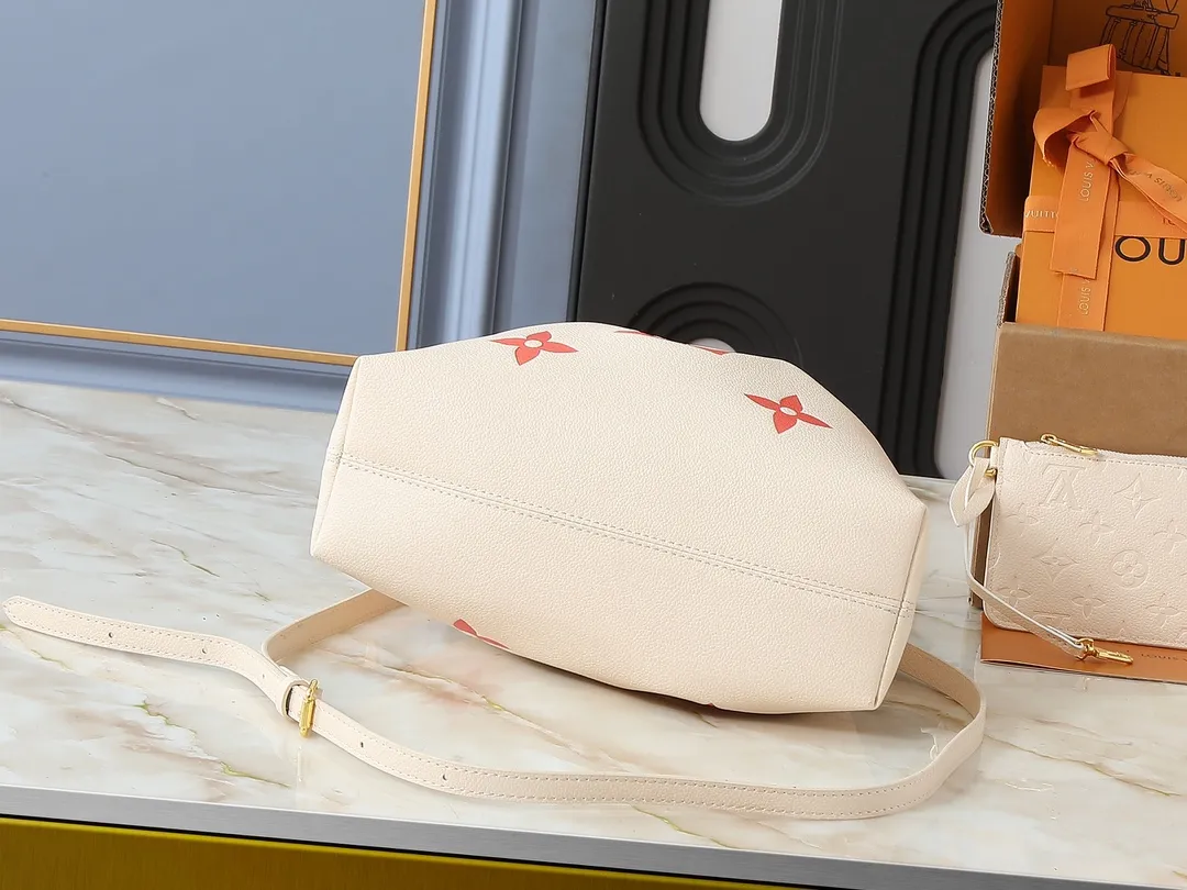 💰260💰Upgraded original version ✨M11283 M25453 M47209 M46545 M46492 This Summer Bundle handbag is from the Dégradé series. The new drawstring design adds a summer atmosphere. The Monogram Empreinte embossed leather bag features a gradient tone to brighten any seasonal look. The double handles and detachable cross-body strap provide a variety of stylish carrying options, making it a great companion for travel day and night. Detailed features: 28 x 20 x 11.5 (Length x Height x Width)