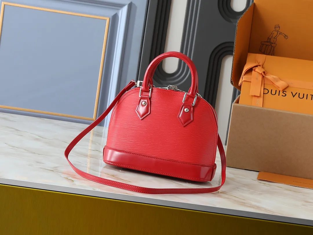 💰240💰Upgraded original M41160 M41327 M40855 M40862 M53152 This Alma BB handbag is based on a classic Louis Vuitton bag designed in 1934 with an Art Deco style. In 2010, on the occasion of the 20th anniversary of the official launch of the Alma bag, a mini model was specially designed for the daughter of the woman who owns this bag. The Alma BB bag features a removable shoulder strap for lightweight cross-body wear. A new and stylish take on a classic shape, this bag in Epi leather is available in a range of bright, vibrant colors. Size: 25×19×12cm