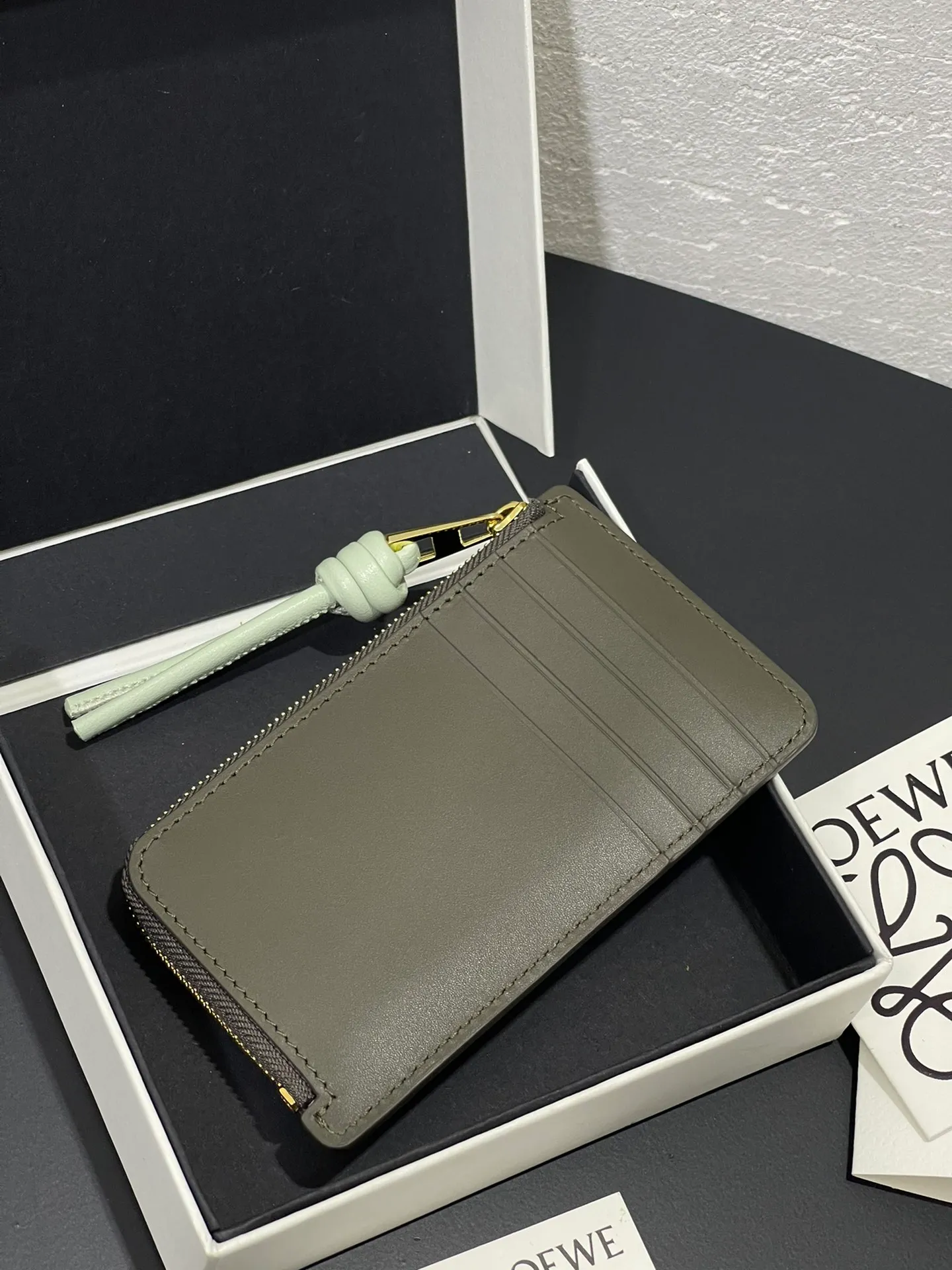 Satin nappa cowhide knot zipper small card holder, sheepskin lining, color-blocked knot pull tab, four card slots and zipper compartment. Style number 3793, size 13.5✕7 💰300