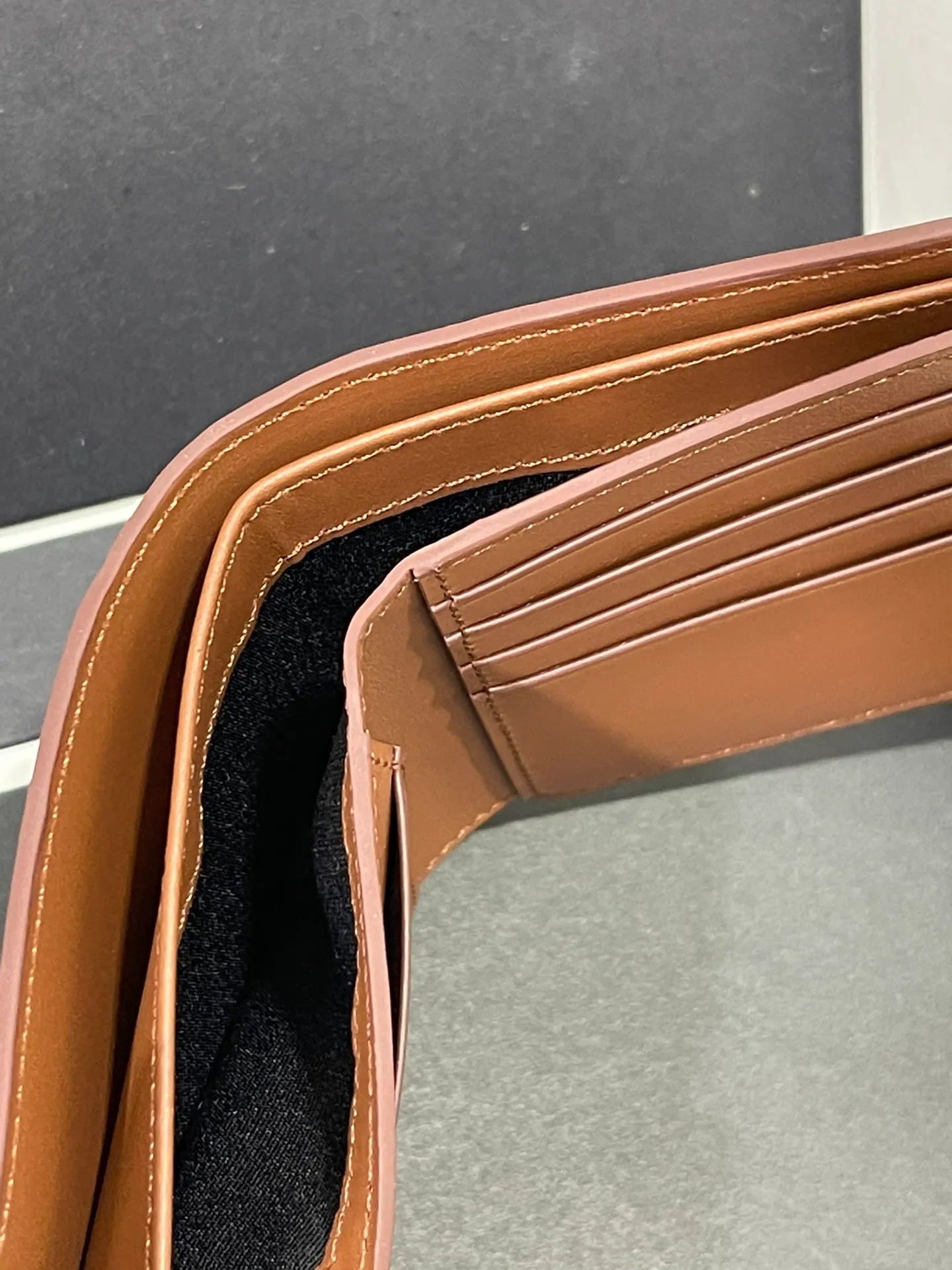 Men's bifold wallet is shipped. The wallet is inspired by the puzzle series handbags. It adopts a unique geometric pattern. It is made of classic calfskin. It has eight card slots and two large pockets. Style number 3801. Size 11*10 💰330