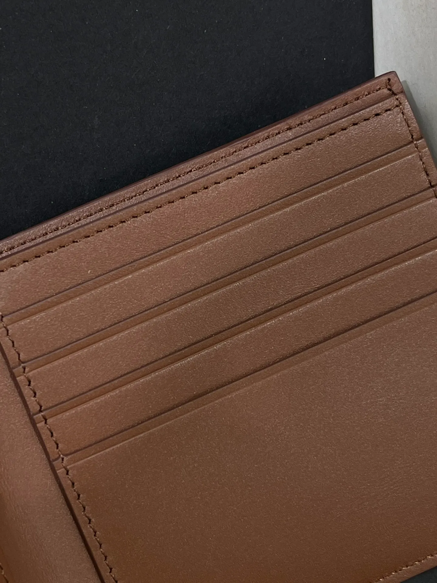 Men's bifold wallet is shipped. The wallet is inspired by the puzzle series handbags. It adopts a unique geometric pattern. It is made of classic calfskin. It has eight card slots and two large pockets. Style number 3801. Size 11*10 💰330
