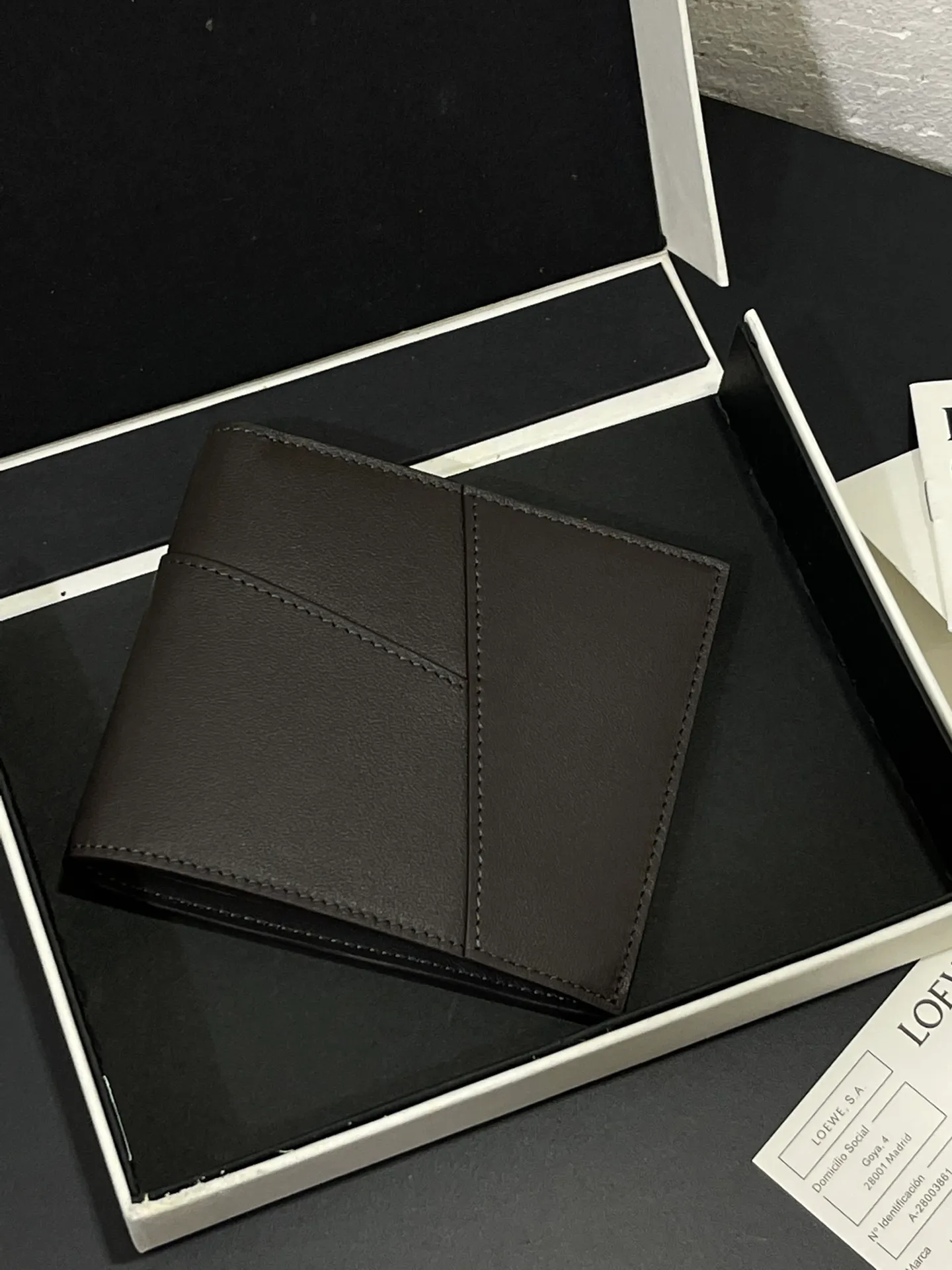 Men's bifold wallet is shipped. The wallet is inspired by the puzzle series handbags. It adopts a unique geometric pattern. It is made of classic calfskin. It has eight card slots and two large pockets. Style number 3801. Size 11*10 💰330