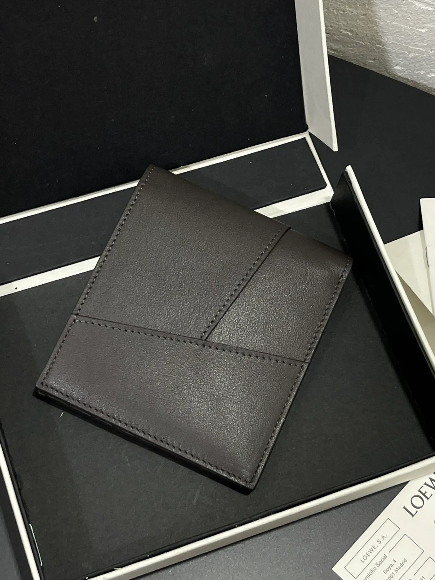 Men's bifold wallet is shipped. The wallet is inspired by the puzzle series handbags. It adopts a unique geometric pattern. It is made of classic calfskin. It has eight card slots and two large pockets. Style number 3801. Size 11*10 💰330