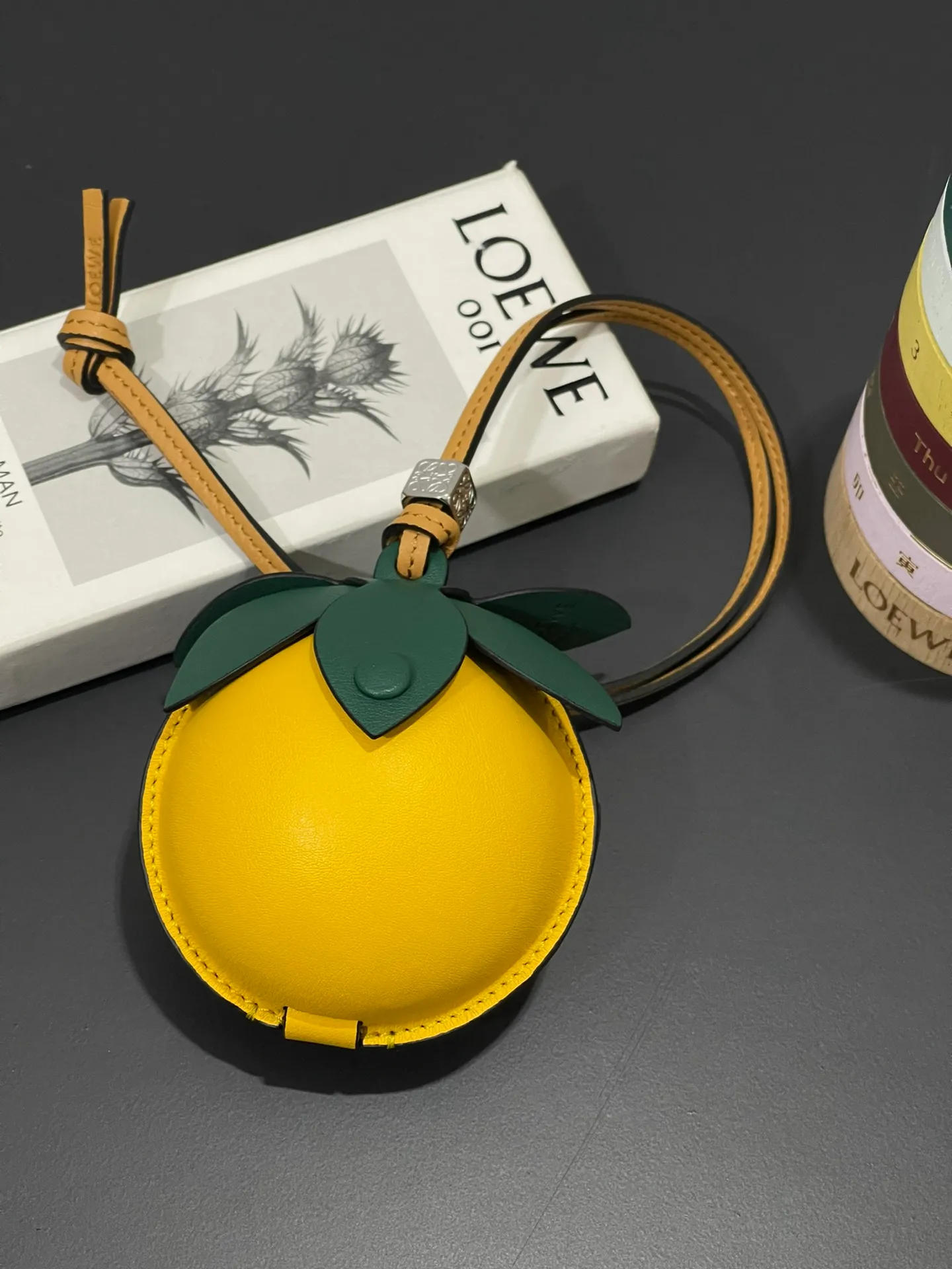 💰880 Passion fruit small bag pendant is made of calfskin with contrasting colors and fastened with snap buttons. It can hold some small items and change inside, and can be hung on the neck or bag.    Style No. 327 Size 12*11 (cards cannot be placed)
