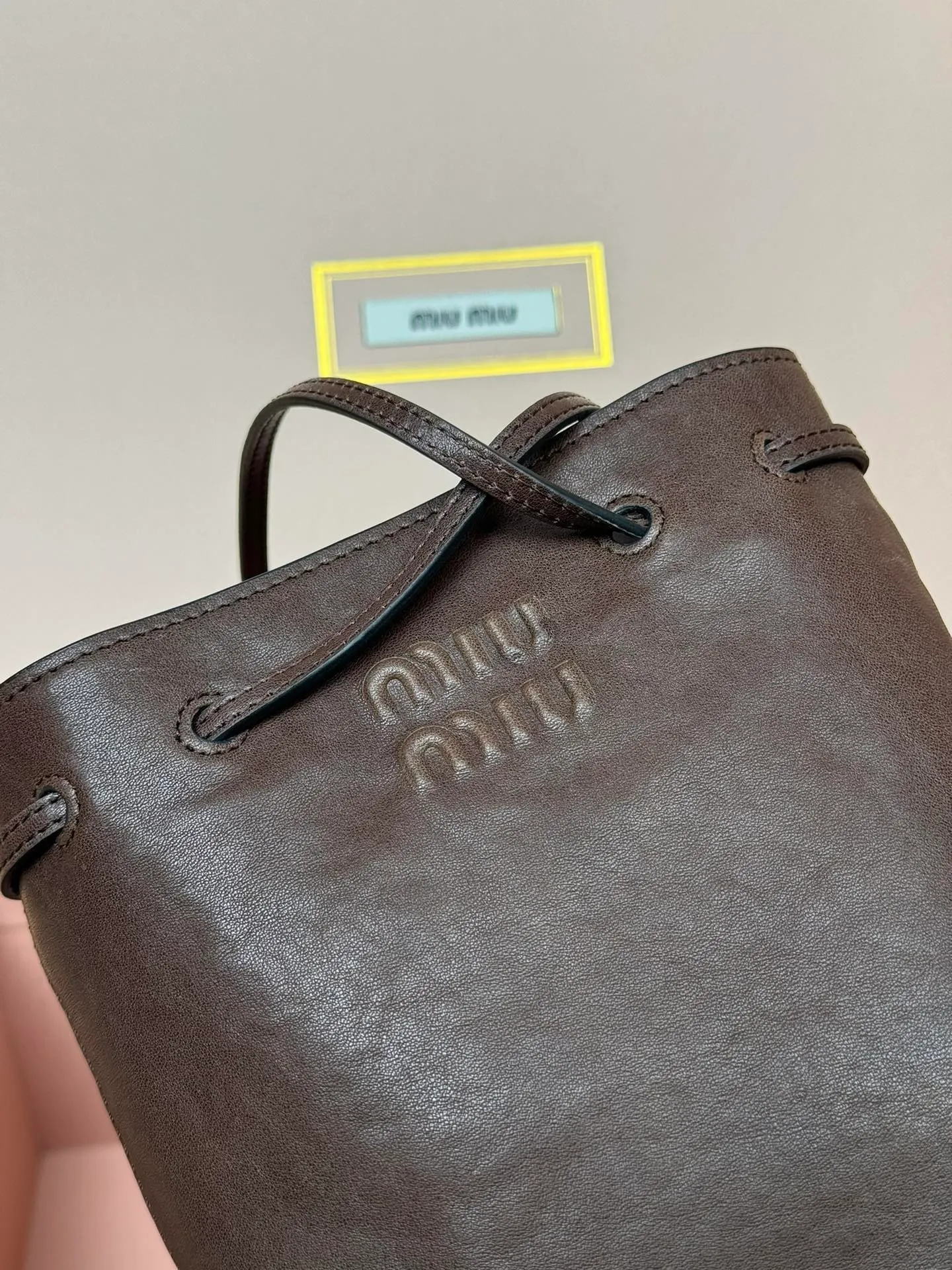 p1040 [Special grade hardware original leather] nappa sheepskin mini handbag shoulder bag ~ brown This mini handbag is famous for the soft texture of nappa sheepskin. Adjustable shoulder strap adds practical detail, while embossed letter logo adds classic style ~ Letter logo ~ Adjustable shoulder strap ~ Lined Model: 5nf460 Dimensions: w14×h17×d6