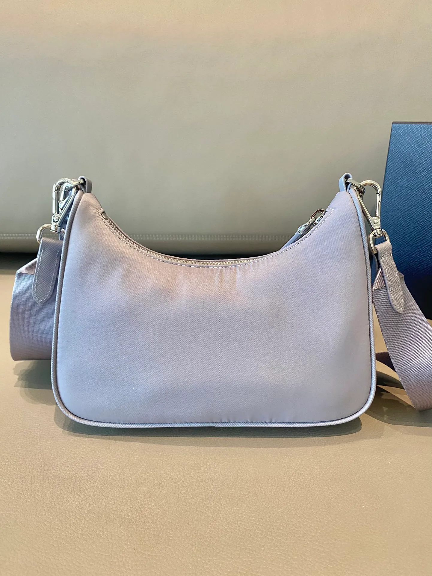 💰1000🎉New model 1BH204, wisteria purple😘New color, new color👏👏 nylon Hobo handbag/underarm bag😘😘Hobo, which is popular in the fashion circle due to the crazy cultivation of the Internet celebrity sister group, has a new model! 👏👏The design of this Hobo bag is great👍👍One bag with three uses😘😘waist bag/crossbody/single shoulder bag👍👍The handle is replaced by a chain. When the armpit bag is a little more sexy, it is also equipped with a long shoulder strap. What I love most is that the shoulder strap also has a small pendant (small bag), which can also be hung with other bags and pants as accessories. 🙊🙊No problem matching any kind of clothes in normal times😘😘Babies, hurry up and get it, it’s so beautiful🙊🙊Length 22X height 12x bottom 6cm👏👏👏💰💰💰