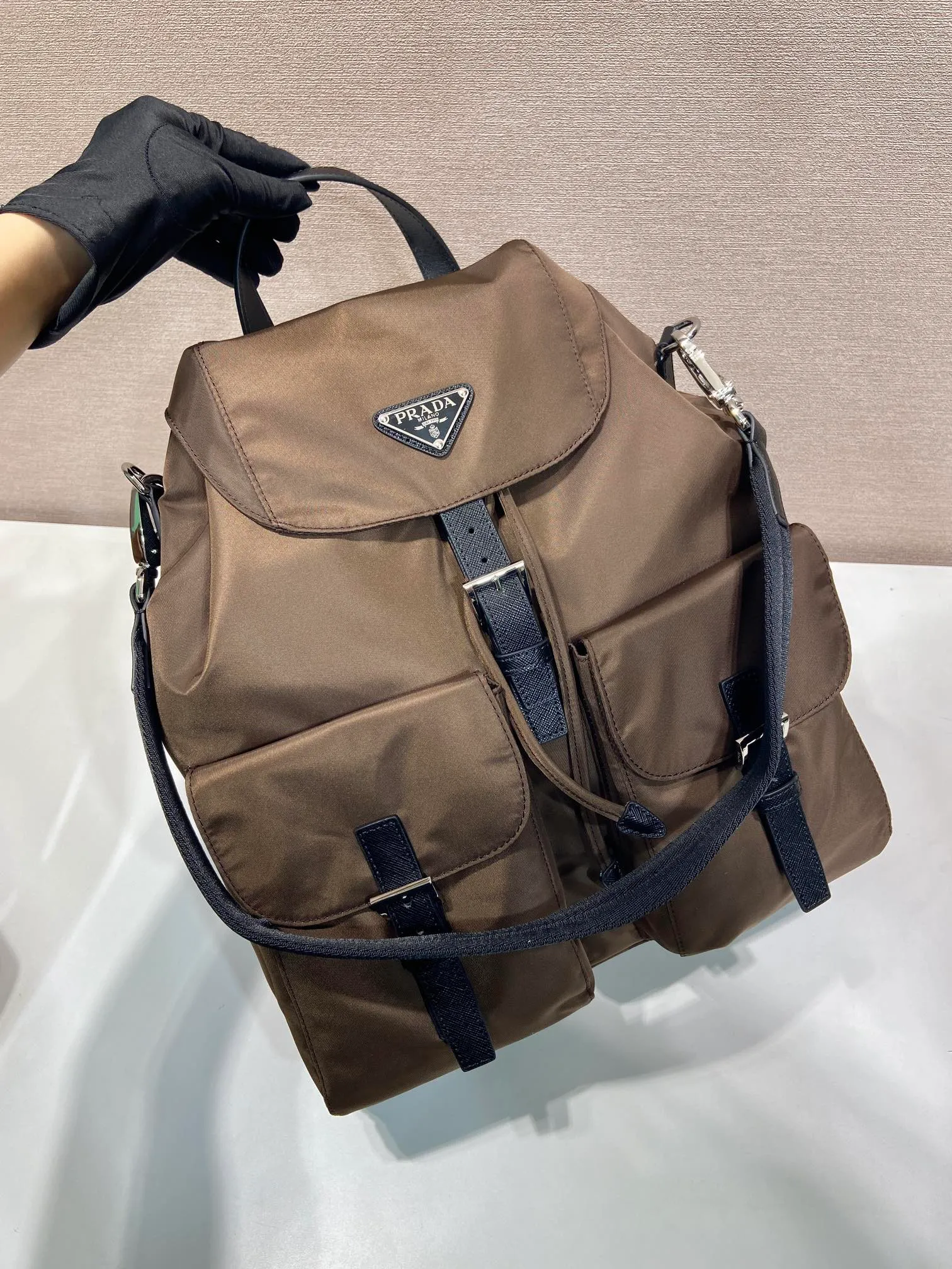 💰1360🎉New Backpack🎉2VZ110A Ocher Brown🎉🎉 This Re-Nylon backpack is designed with classic nylon fabric, top-grade hardware, and integrated with innovative and practical elements, presenting a refined and timeless style. Equipped with a detachable shoulder strap, it can be used interchangeably on different occasions. The upper body effect is very fashionable and elegant, and it is a popular style that will never go out of style🎉Hurry up and get it🎉🎉 Length 34x Height 39x Bottom 15cm🎉🎉🎉🎉👏👏👏