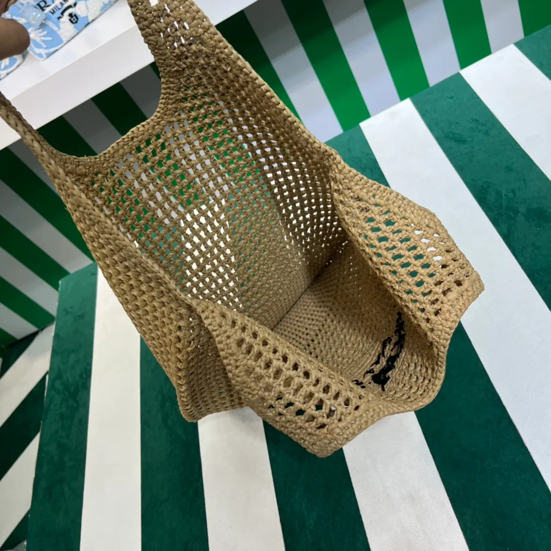 💰1360{Apricot｝🏝 Prad* new hollow straw tote! Full of artistic atmosphere ~ The raffia weave is very solid and has a great texture. ♡ It can be paired with personal clothes every day. The natural style design makes it seem like it can breathe💭 If you like the baby, quickly add it to the harem. Carry an exclusive style that will not go out of style for several years🌱1BG424 Size: Height 45x Width 51cm