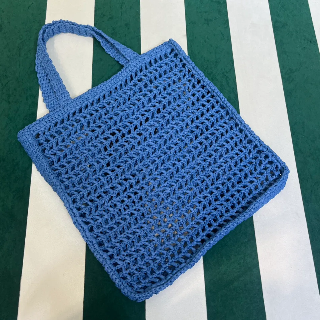 💰1160 Raffia Upgraded Version/Blue🦋 𝗣𝗿'𝗮𝗱𝗮Raffia Fiber Tote Bag Made of high-quality imported raffia🌿 Purely handmade! Every craftsman makes it with care and crochets it stitch by stitch! How can summer outings, picnics, and photo shoots be complete without a beautiful, lightweight and chic straw bag? 393 Size: 36×4×38cm