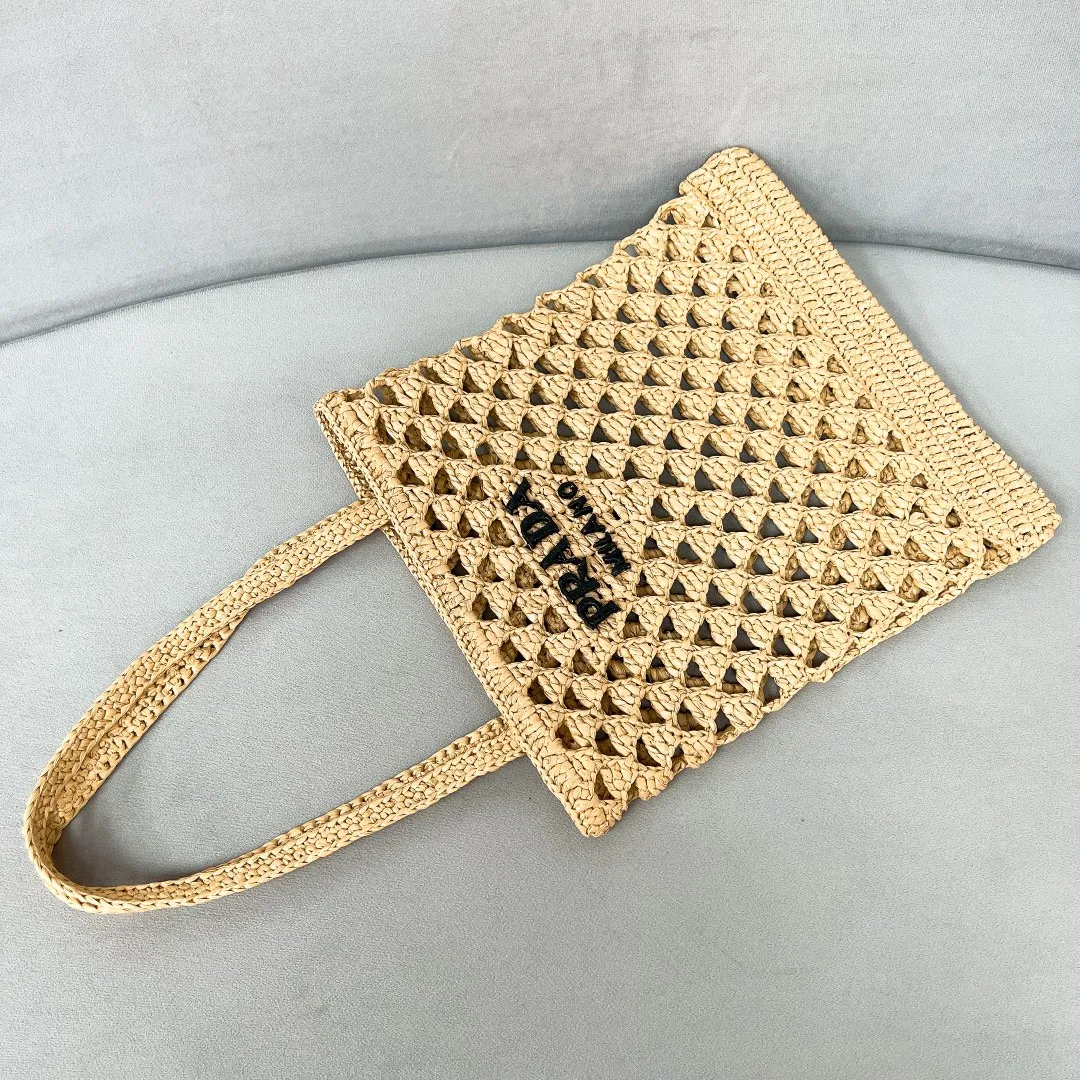 💰1360, new raffia beach bag 1BG493, an excellent choice for travel and vacation🏖️Handmade with raffia, the light and natural material expresses summer mood. Embroidered lettering triangle logo on the front, with long exquisite shoulder handles. Super large capacity and very light weight. Wear-resistant, waterproof, durable and good-looking. Can be carried by hand, shoulder or shoulder. New favorite of fashion trendsetters. Perfect details. Comparable to brick cabinets. Excellent 5🌟 evaluation Size: 30*29.5cm