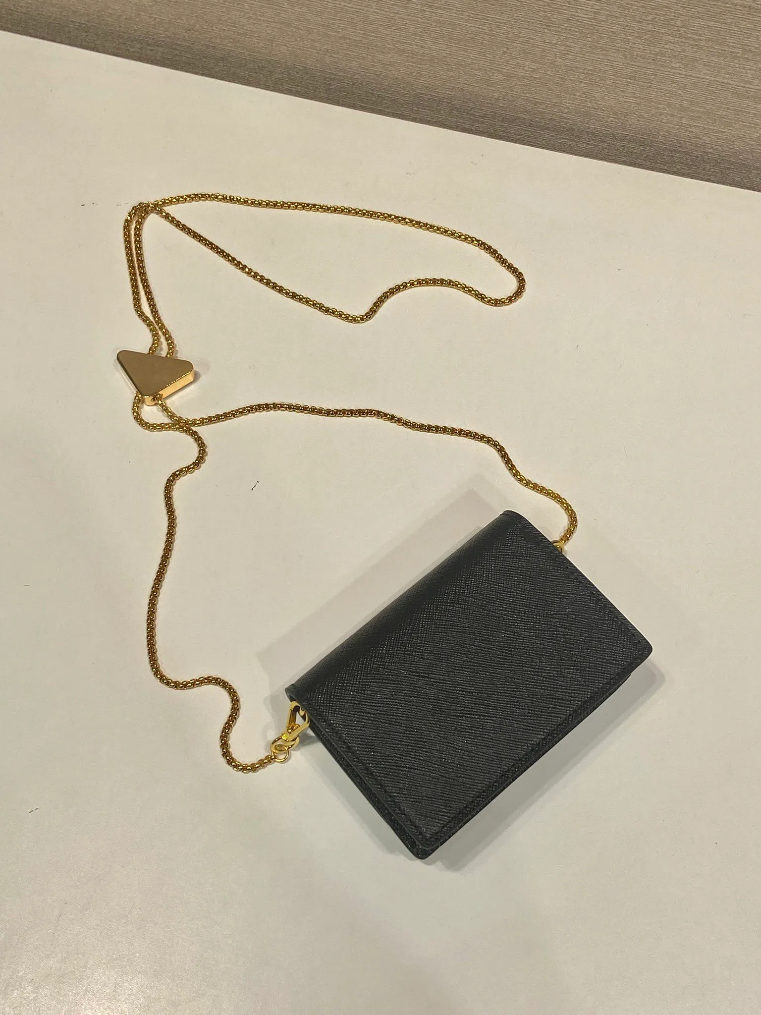 🎉Chain Card Holder🎉1MR024 Mini🎉🎉 This exquisite and versatile flip card holder is equipped with a detachable chain shoulder strap, which adds gorgeous style and is easy to carry in a variety of ways. It can also be used as a waist bag👍The metal engraved logo decorates the front material of the Saffiano leather jacket, which is fashionable and versatile. It can accommodate lipstick, keys, and cards. It’s so cute😘babies. Come in quickly😘😘 Length 11.5x height 8x base 2.5cm🎉🎉🎉💰💰💰