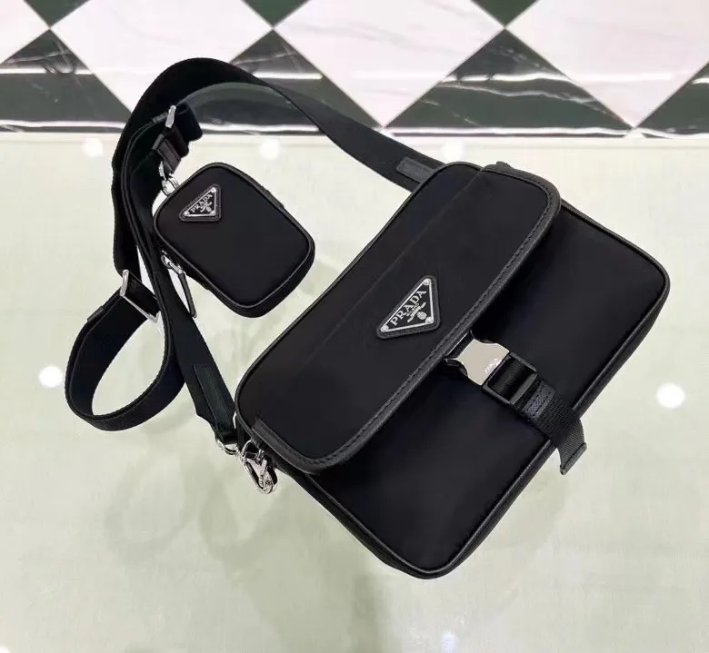 p600¥🎉New messenger bag🎉2VH133B🎉🎉This crossbody bag is made of imported nylon fabric, top-grade hardware🎉🎉Detachable and adjustable nylon strap and leather shoulder strap, with detachable pouch, flip cover coated with enamel gold It has a triangular logo zipper closure, external pockets, a flap and side opening buttons, and a recycled nylon lining. It is lightweight and practical, and it is a popular style that will never go out of style🎉🎉Worth owning🎉🎉Length 22x Height 16x Bottom 5cm