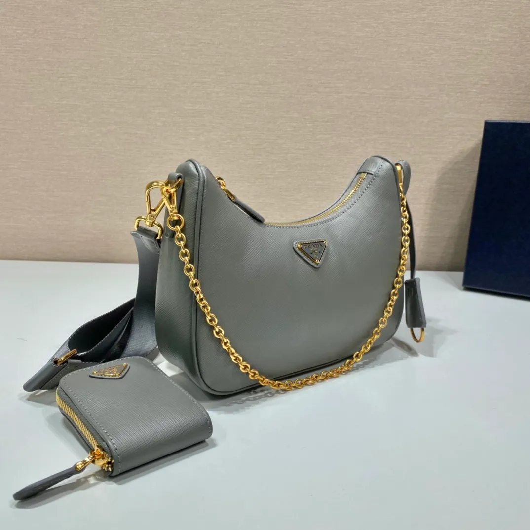 💰1500🎊Gold hardware three-in-one🎊New model 1BH204 full leather/gold hardware, nylon Hobo hand/armpit bag😘😘The full leather hobo that is popular in the fashion circle due to the crazy cultivation of the Internet celebrity sister group has a new model! 👏👏The design of this all-leather Hobo bag is great👍👍One bag with three uses😘😘waist bag/crossbody/single shoulder bag👍👍The handle is replaced by a chain, which makes the underarm bag a little more sexy. It also has a long shoulder strap. What I love most is that there is a small pendant (small bag) hanging on the shoulder strap, which can also be hung on other bags and pants as accessories. 🙊🙊There is no problem in matching various clothes in normal times😘😘Babies, hurry up and get it, it’s so beautiful🙊🙊Dimensions: length 23x height 17x bottom 6.5cm👏👏👏
