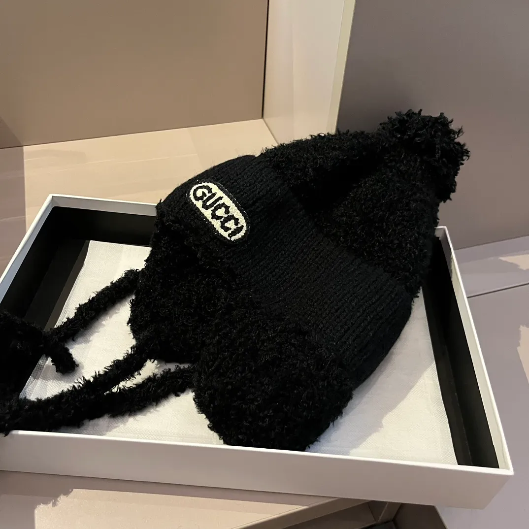 Gucci knitted ear protection beanie