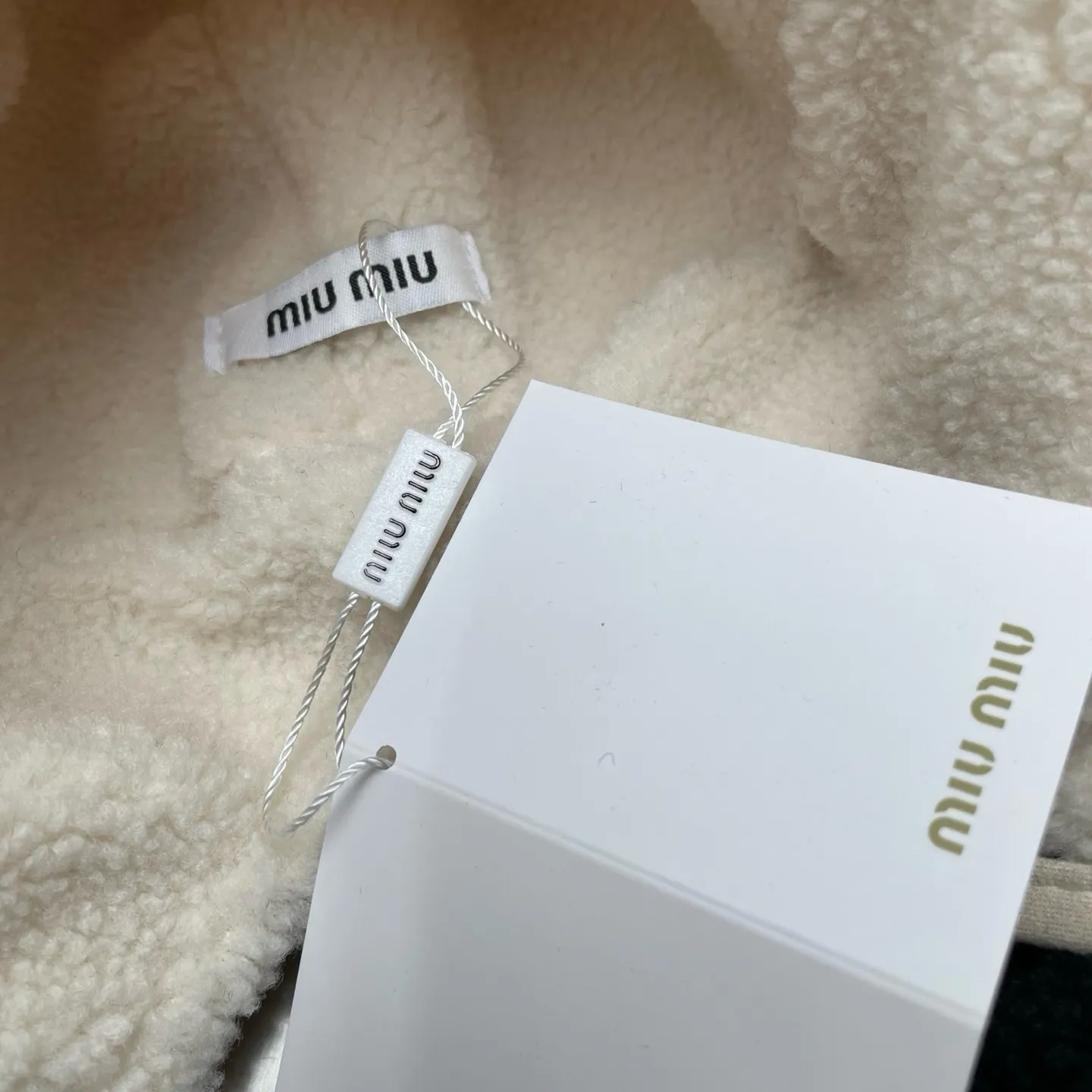 miumiu high version ear protection hat Lei Feng hat