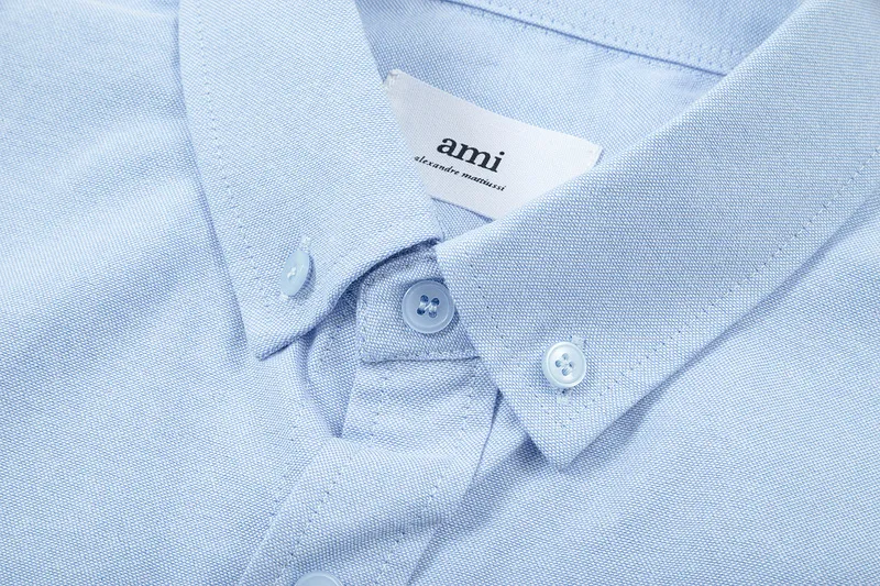 AMI Paris classic autumn red small heart embroidery on the chest, casual cotton solid color short-sleeved Oxford shirt, original custom-made 180g pure cotton fabric, loose off-shoulder version, same style for men and women. Color: brown, Baolan Tianlan, green, yellow, gray, white, pink, size: S-XL