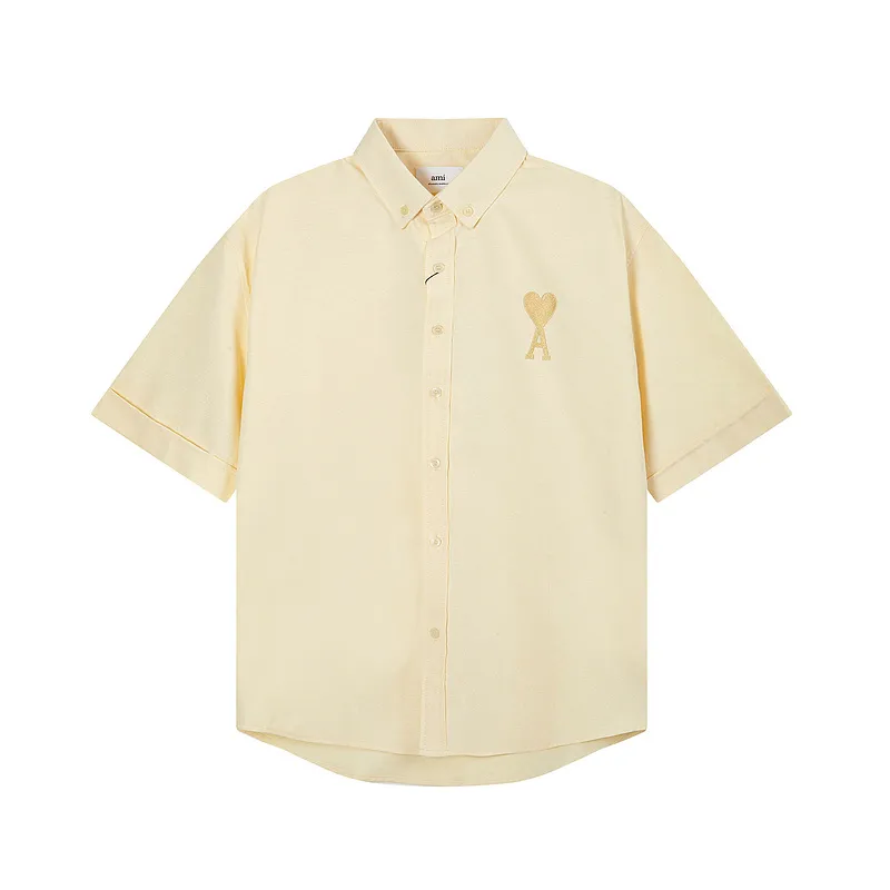 AMI Paris classic autumn heart embroidery in the same color on the chest. Casual cotton solid color short-sleeved Oxford shirt. Original custom-made 180g pure cotton fabric. Loose off-shoulder version. Same style for men and women. Color: Tianlan, white, green, pink, yellow, size: S-XL