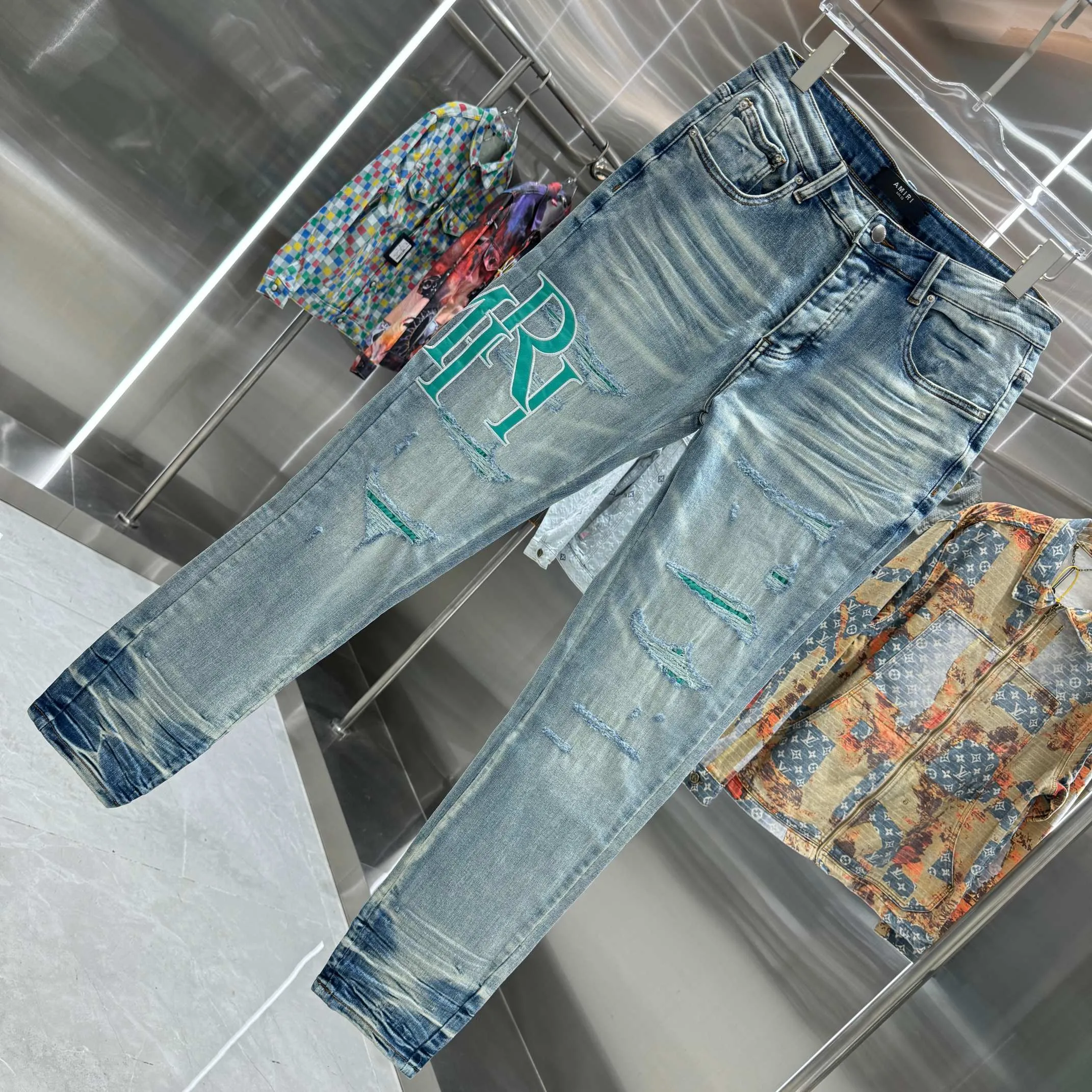 P290 Amiri ripped letter embroidery craft street fashion slim fit stretch jeans color blue size 30 32 34 36 38