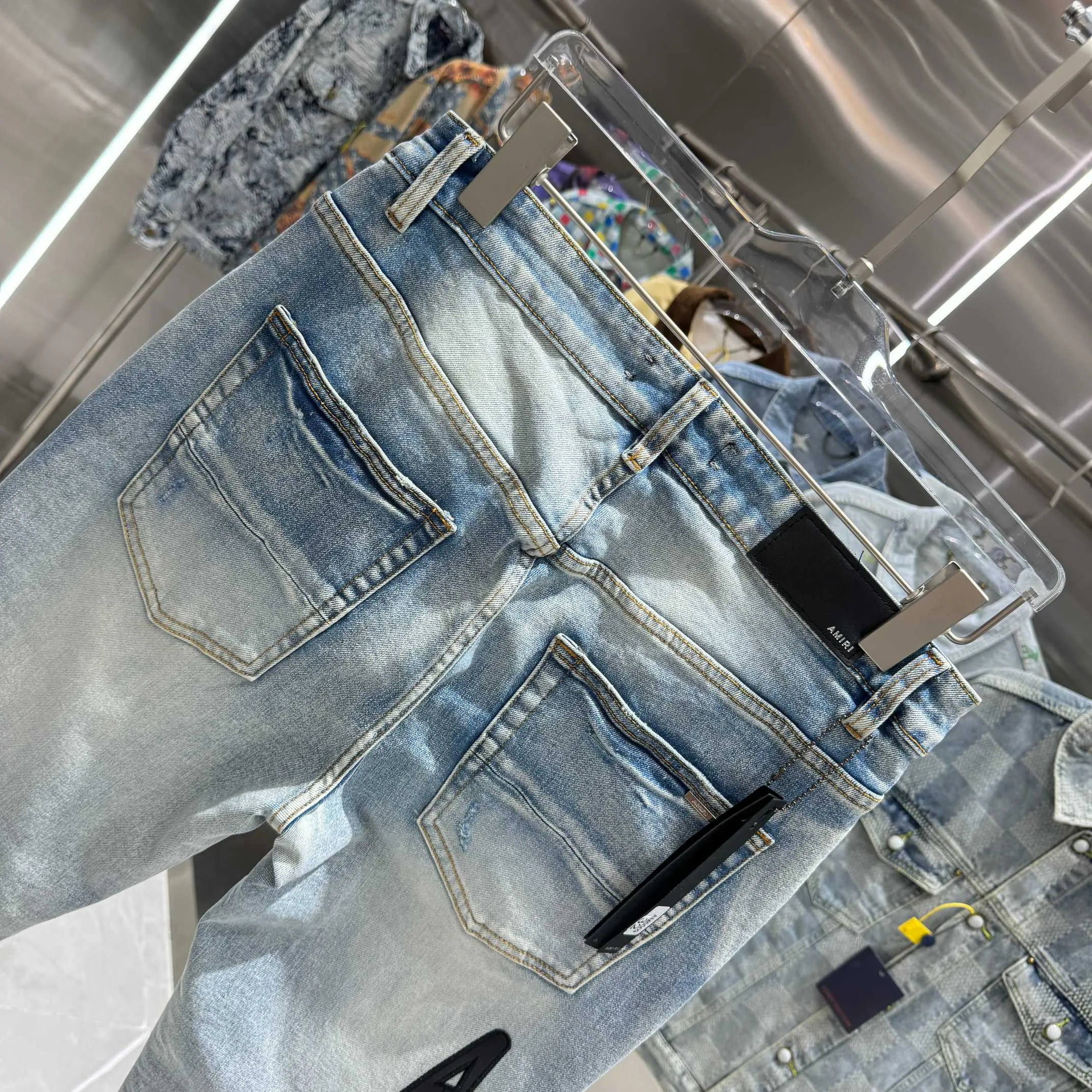 P290 Amiri ripped letter embroidered street fashion slim fit stretch jeans Color light blue Size 30 32 34 36 38