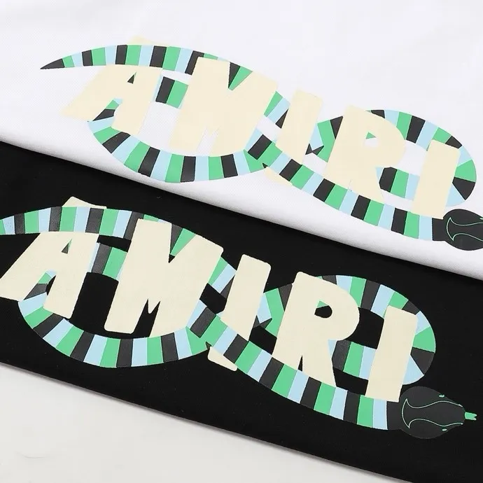 Style number: 689 P120 Fabric: 260g double yarn AMIRI 2025 spring and summer new logo round neck T-shirt high street men and women loose classic letter long snake short sleeves Color: white black Size: S M L XL