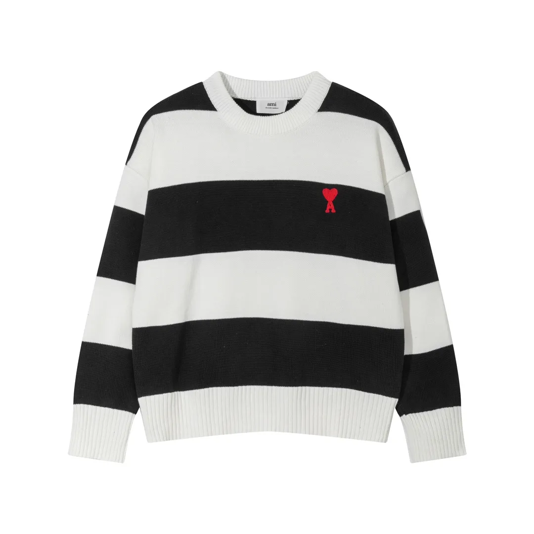 A069# AMI Paris2023 new product. Carefully woven with cotton and wool blended yarn. It has dropped shoulder sleeves and a classic round neck. The blue and white striped body is simple and eye-catching. The red embroidery on the chest easily illustrates the brand identity. Same style for men and women. Color: black and white, orchid white. Size: S-XL