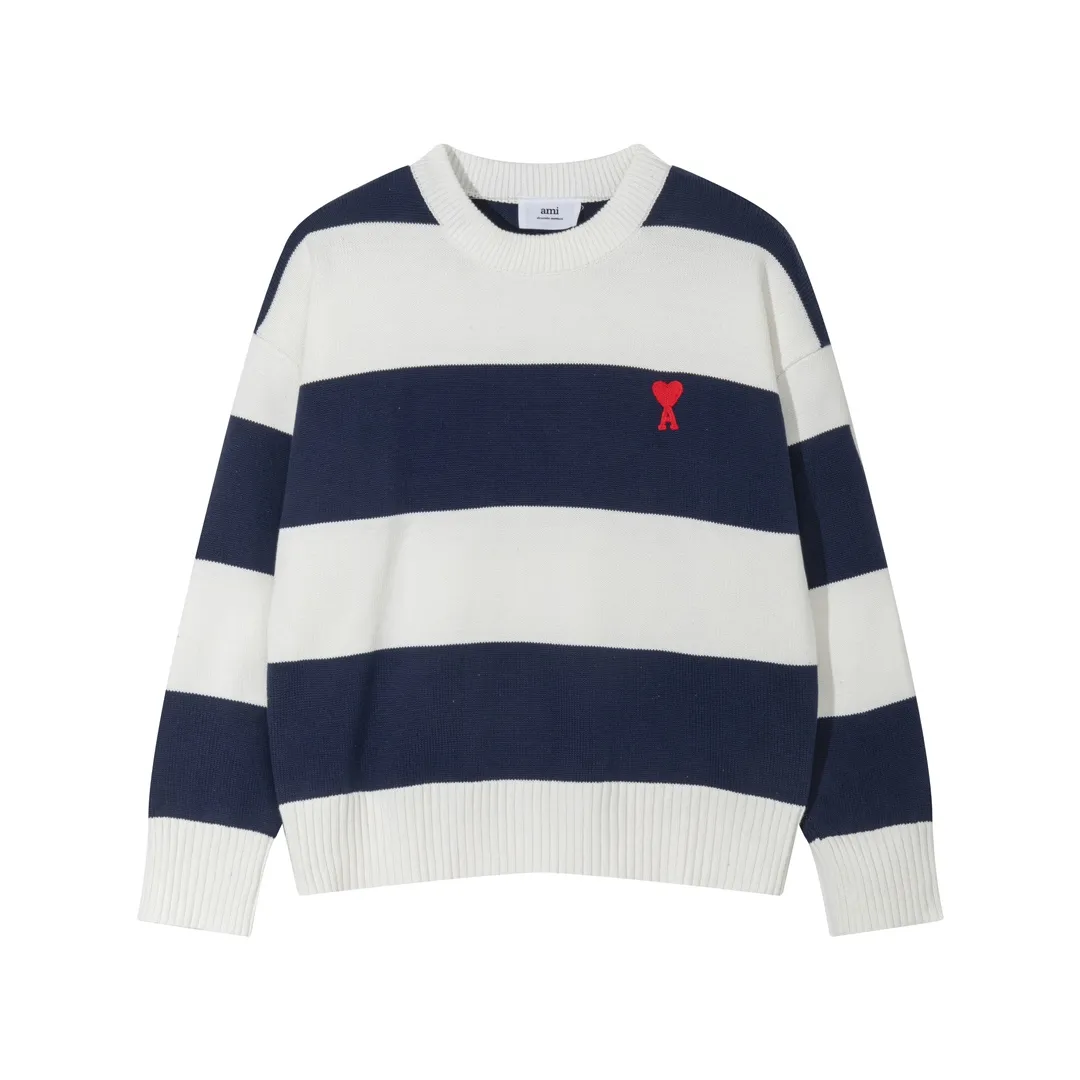 A069# AMI Paris2023 new product. Carefully woven with cotton and wool blended yarn. It has dropped shoulder sleeves and a classic round neck. The blue and white striped body is simple and eye-catching. The red embroidery on the chest easily illustrates the brand identity. Same style for men and women. Color: black and white, orchid white. Size: S-XL