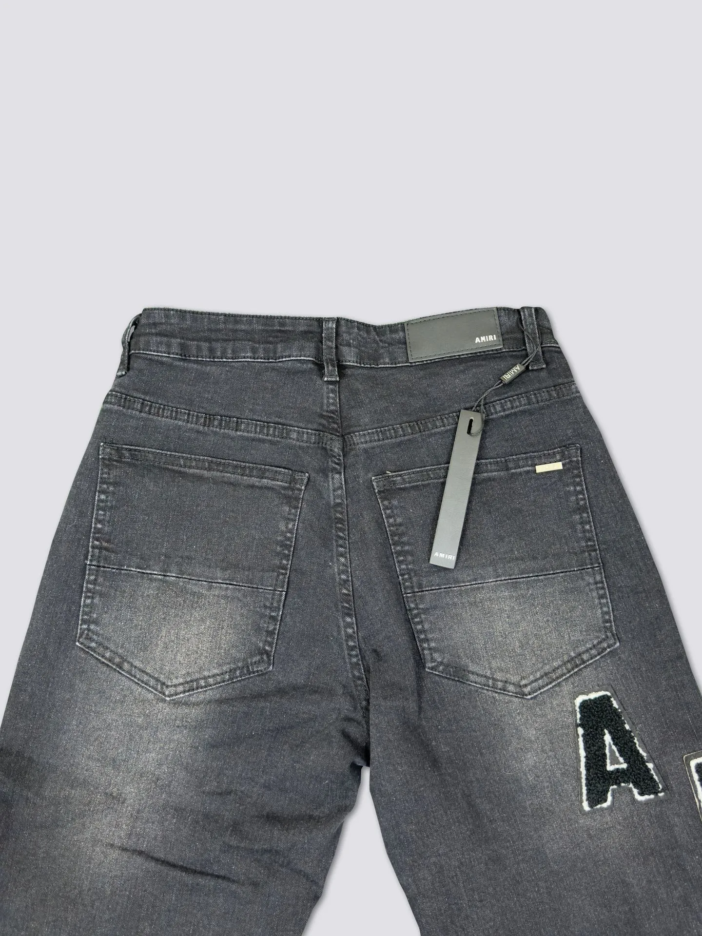 AMIRI's new jeans washed towel embroidered logo denim trousers are the same for men and women Color: Black Size: S-XL (28-34)